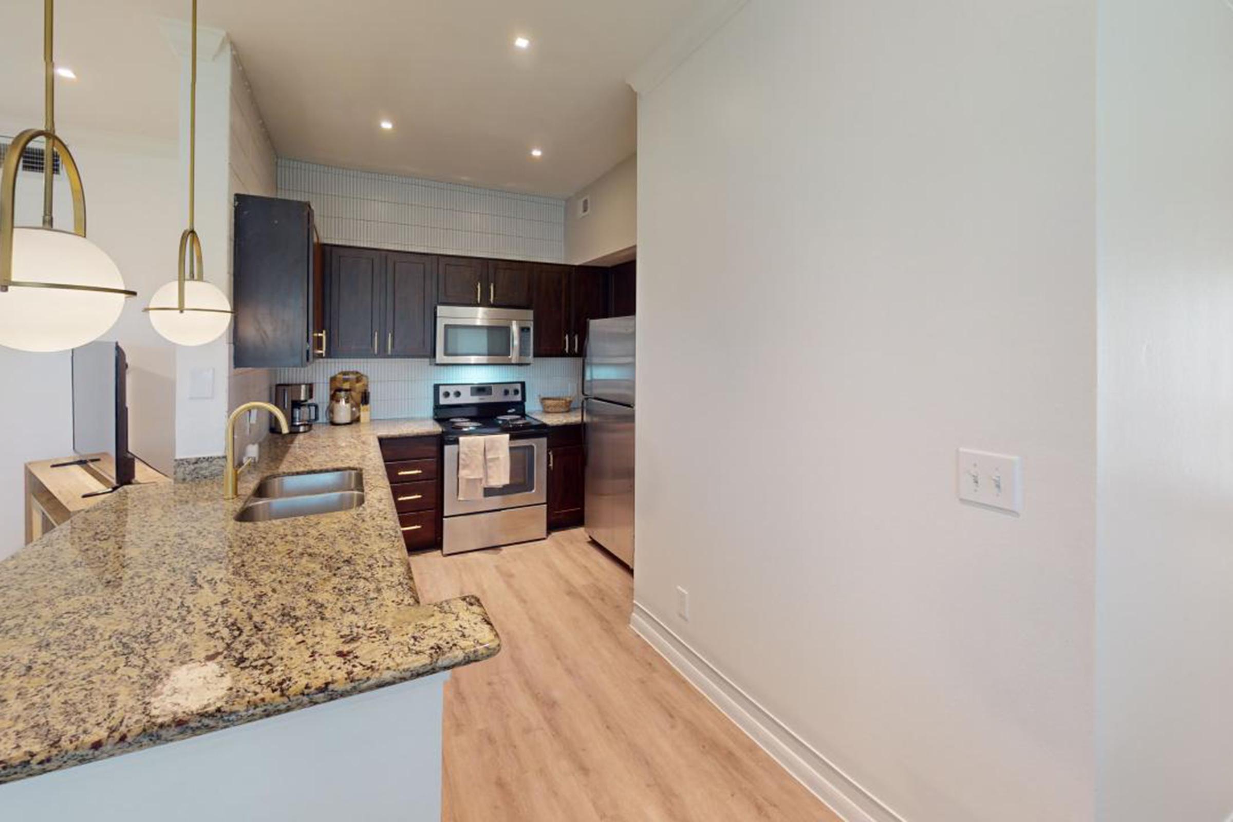 a modern kitchen with stainless steel appliances