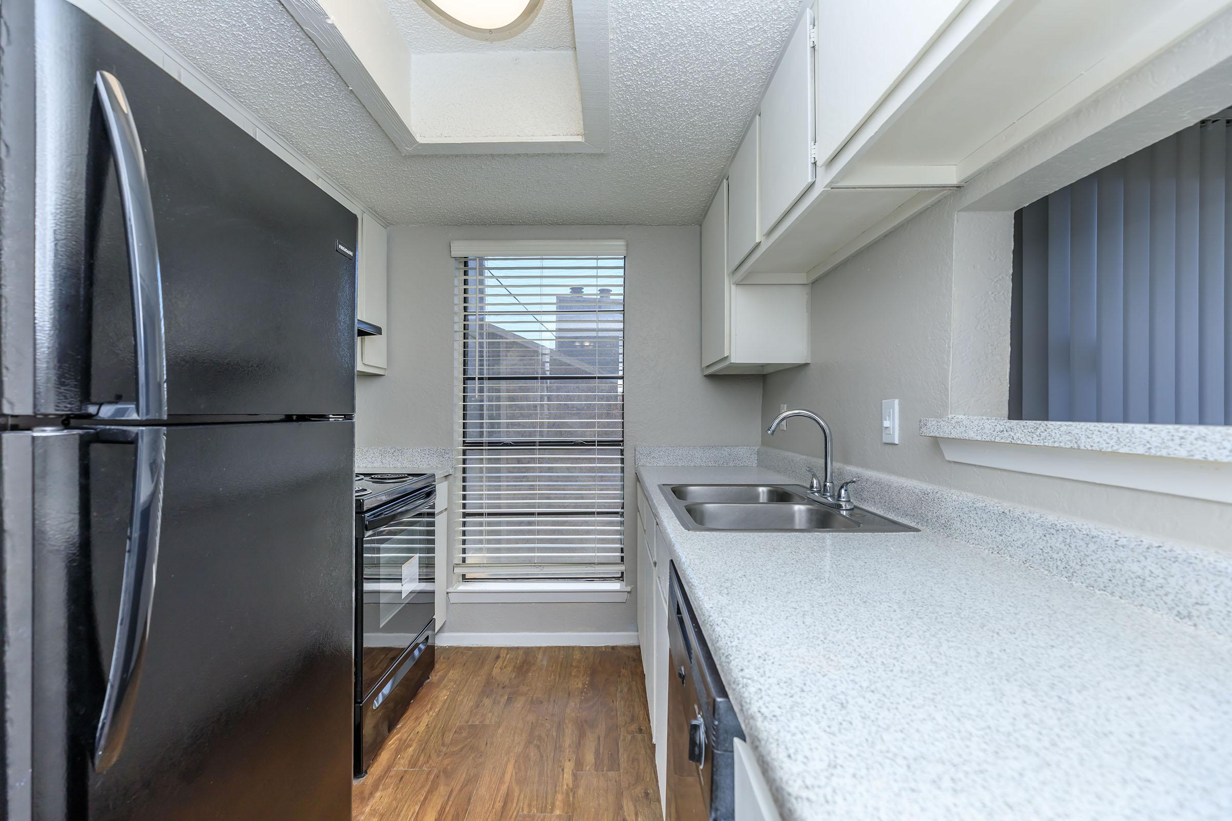 a large kitchen with stainless steel appliances