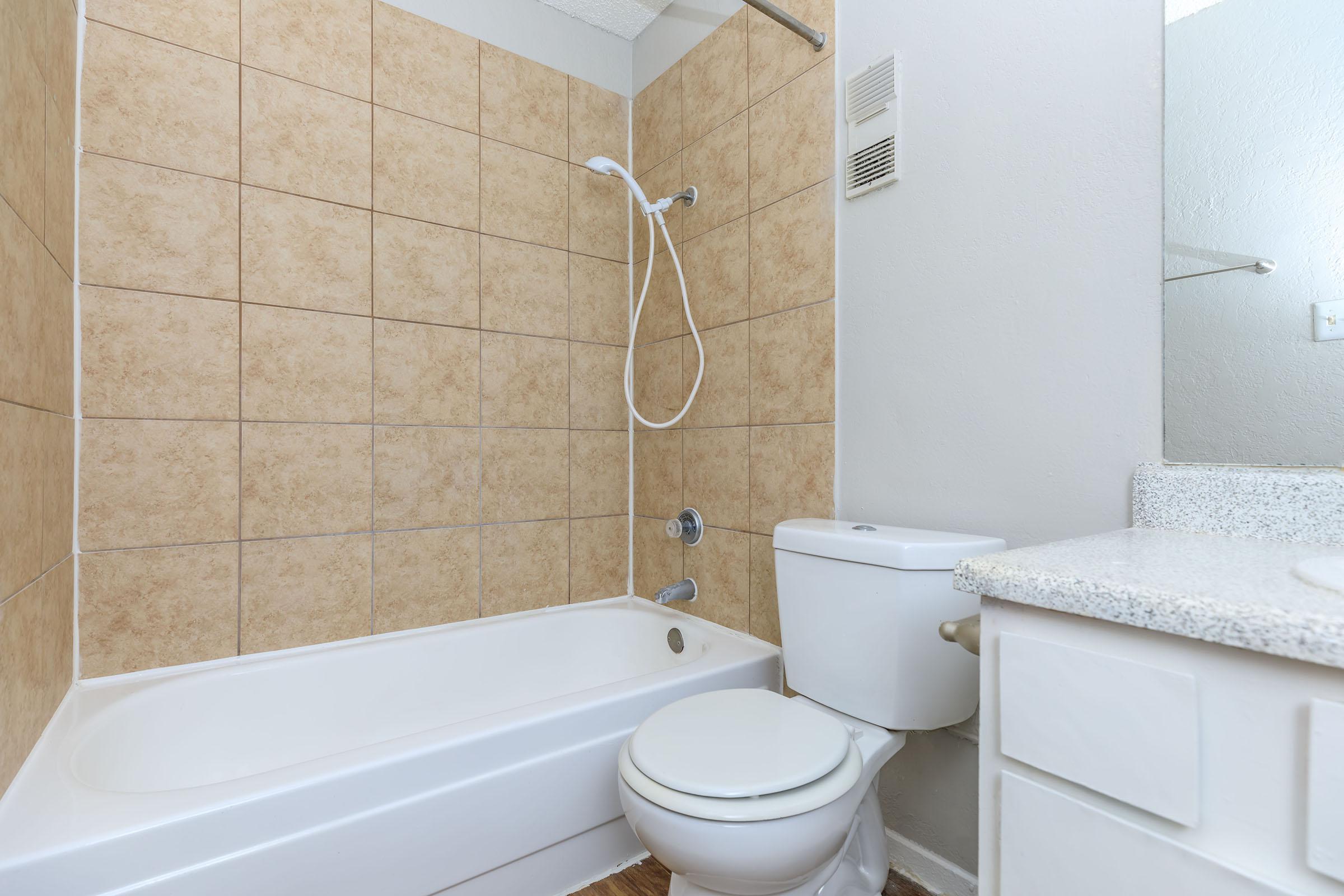 a close up of a sink and a bath tub