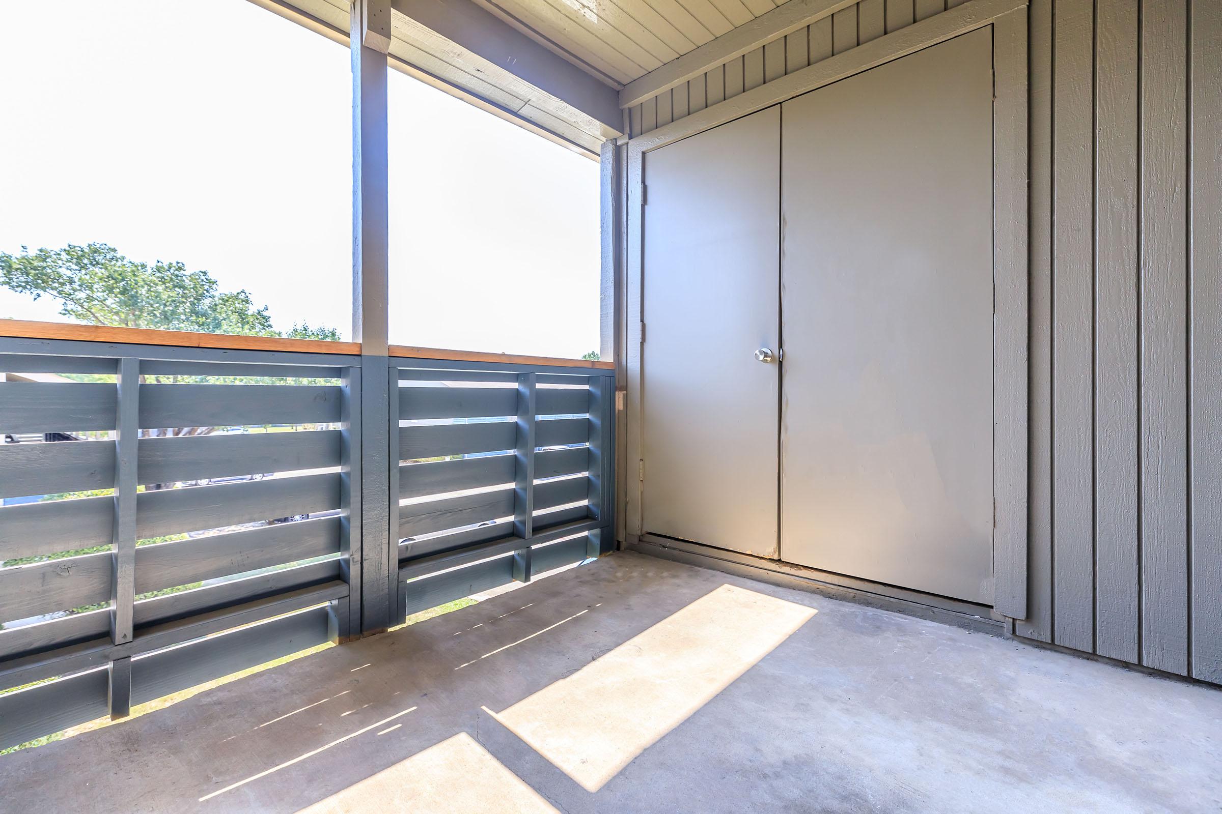 a building with a metal fence