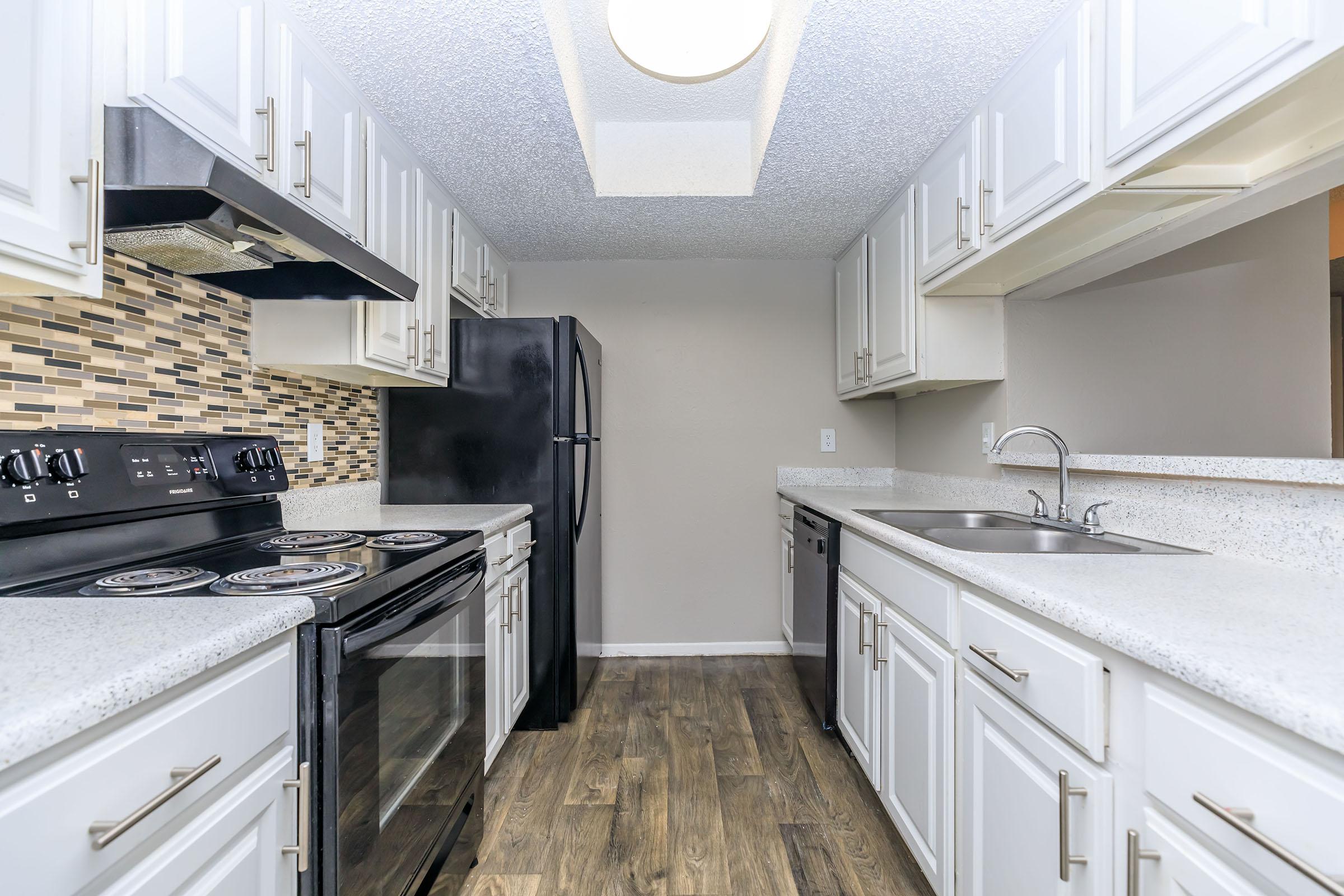 a kitchen with a stove top oven