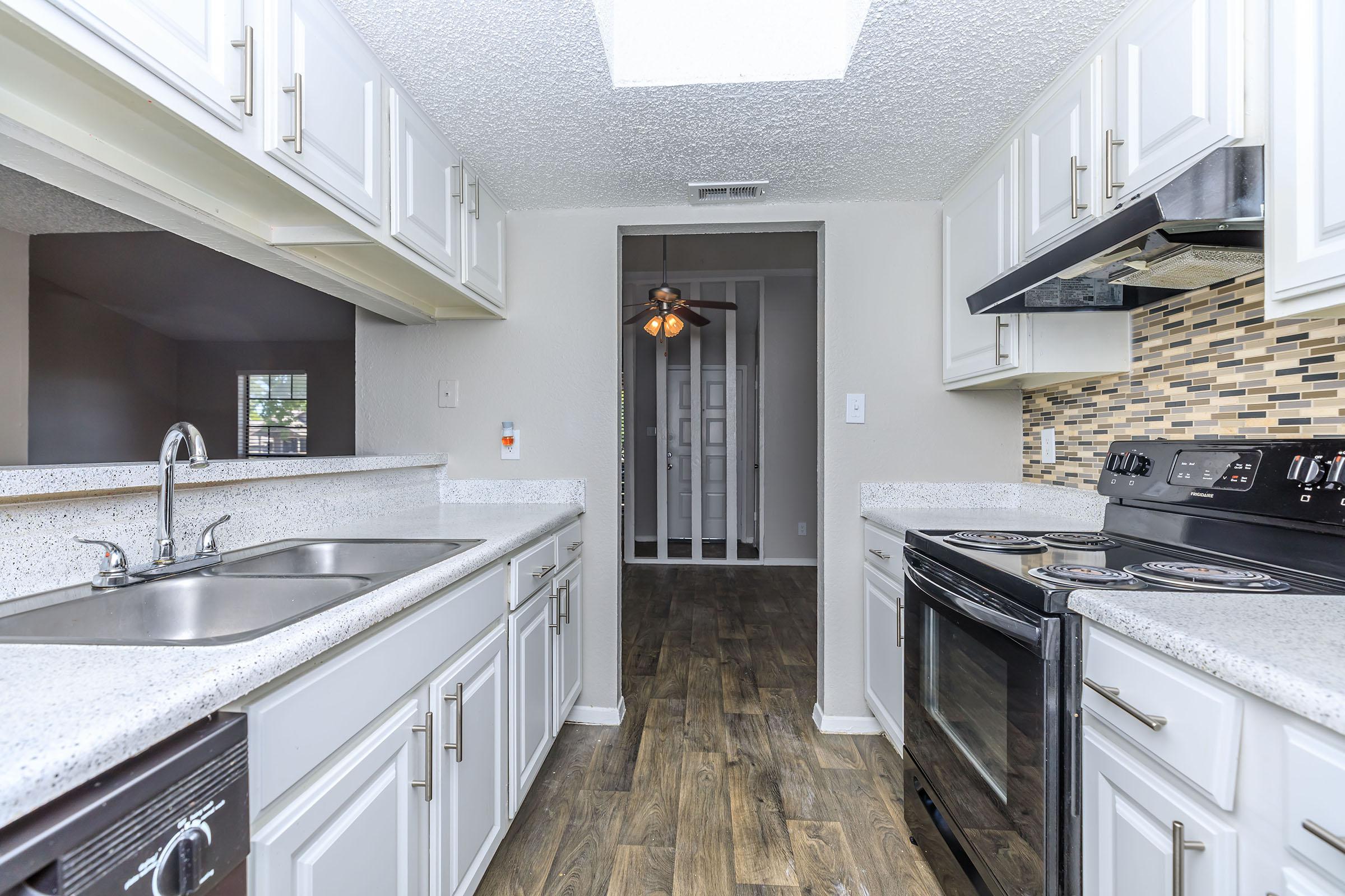 a large kitchen with stainless steel appliances