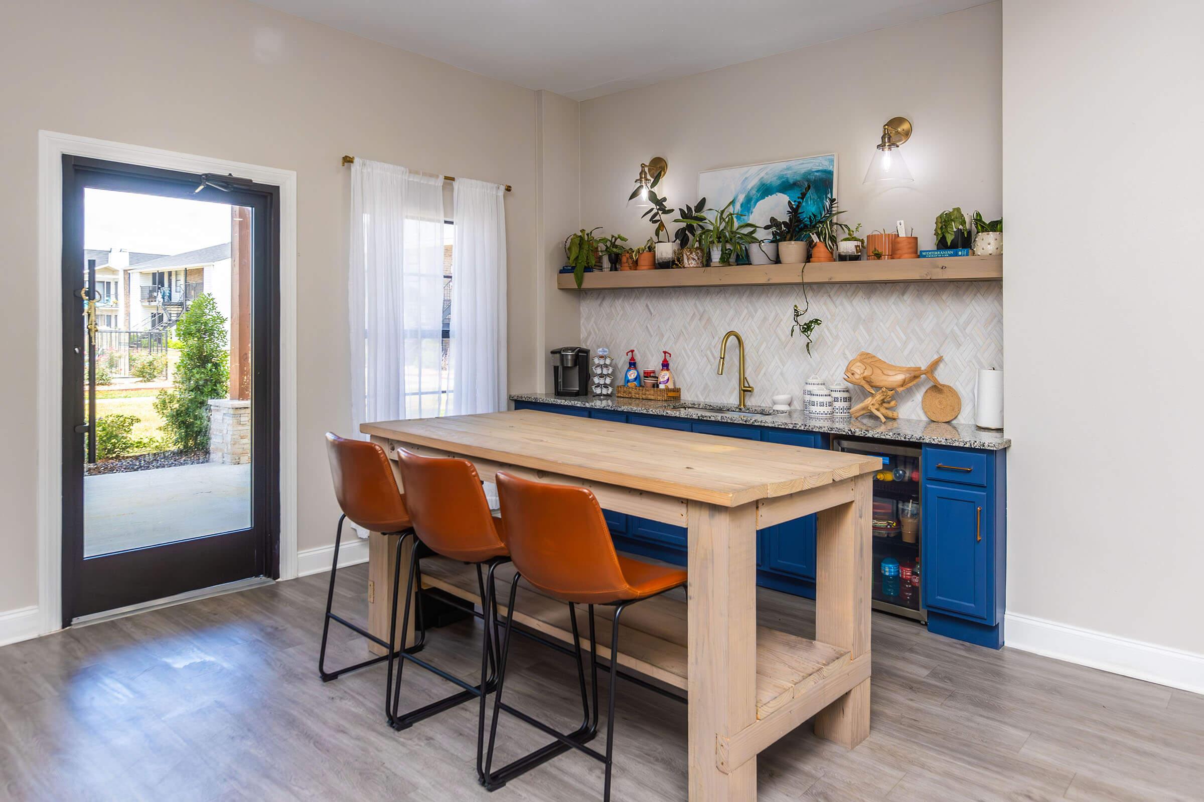 a kitchen with a table in a room