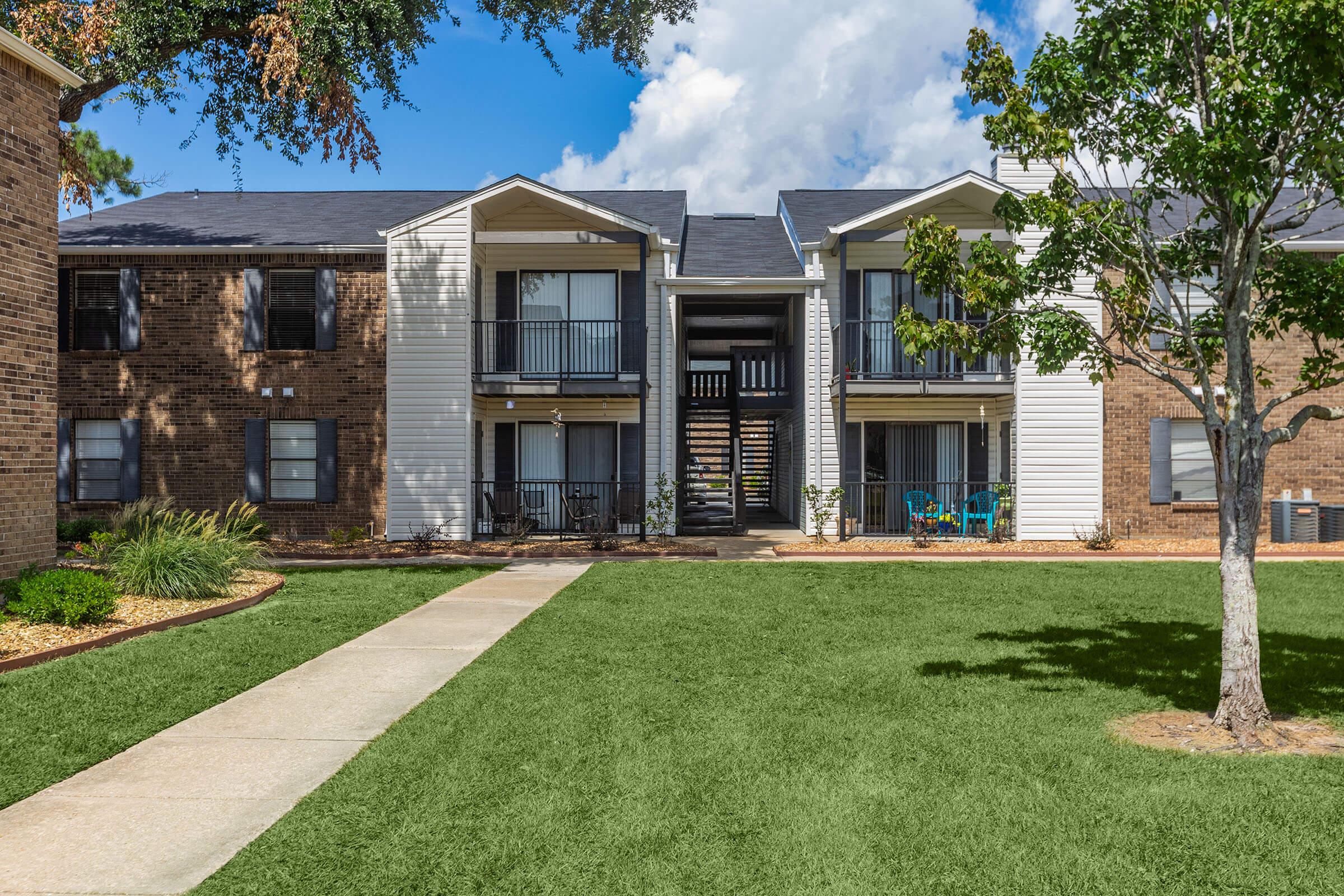 a large lawn in front of a house