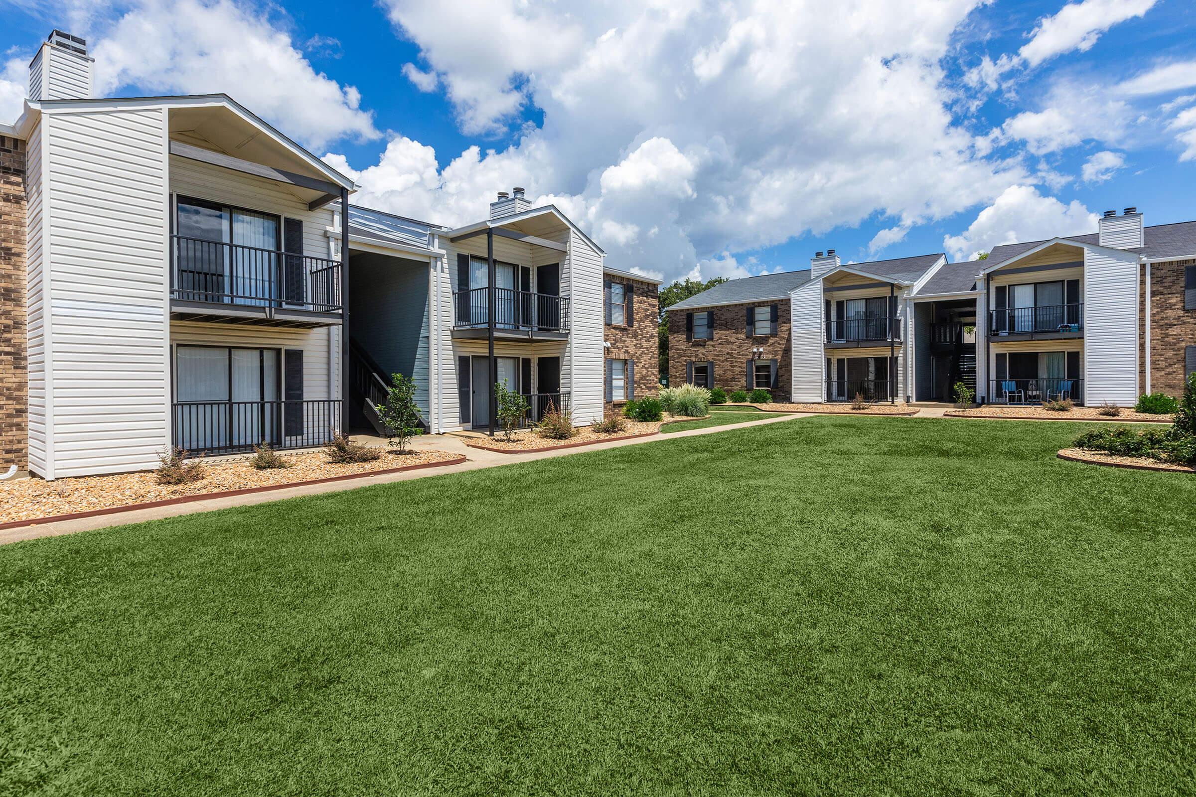 a large lawn in front of a house