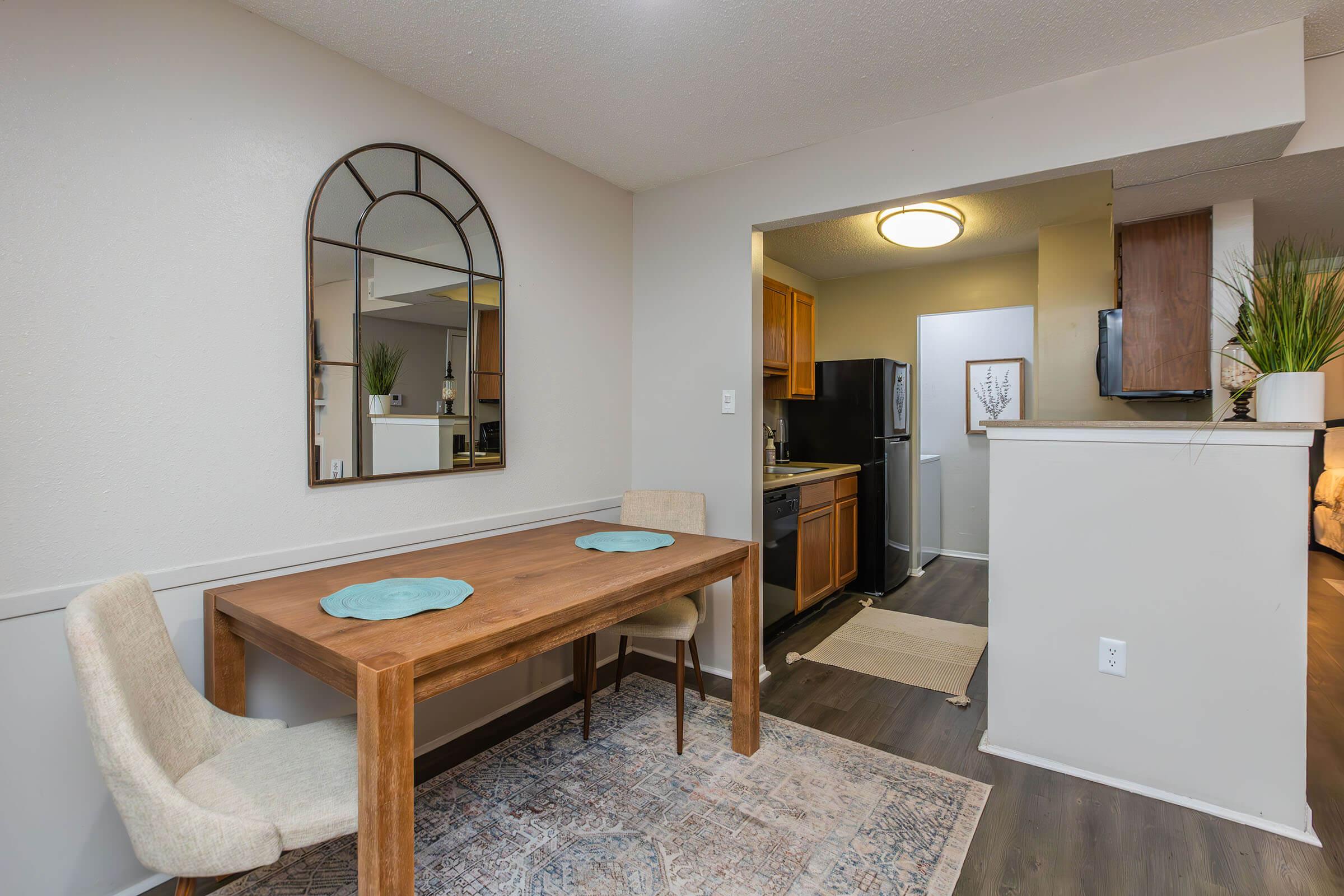 a kitchen with a table in a room