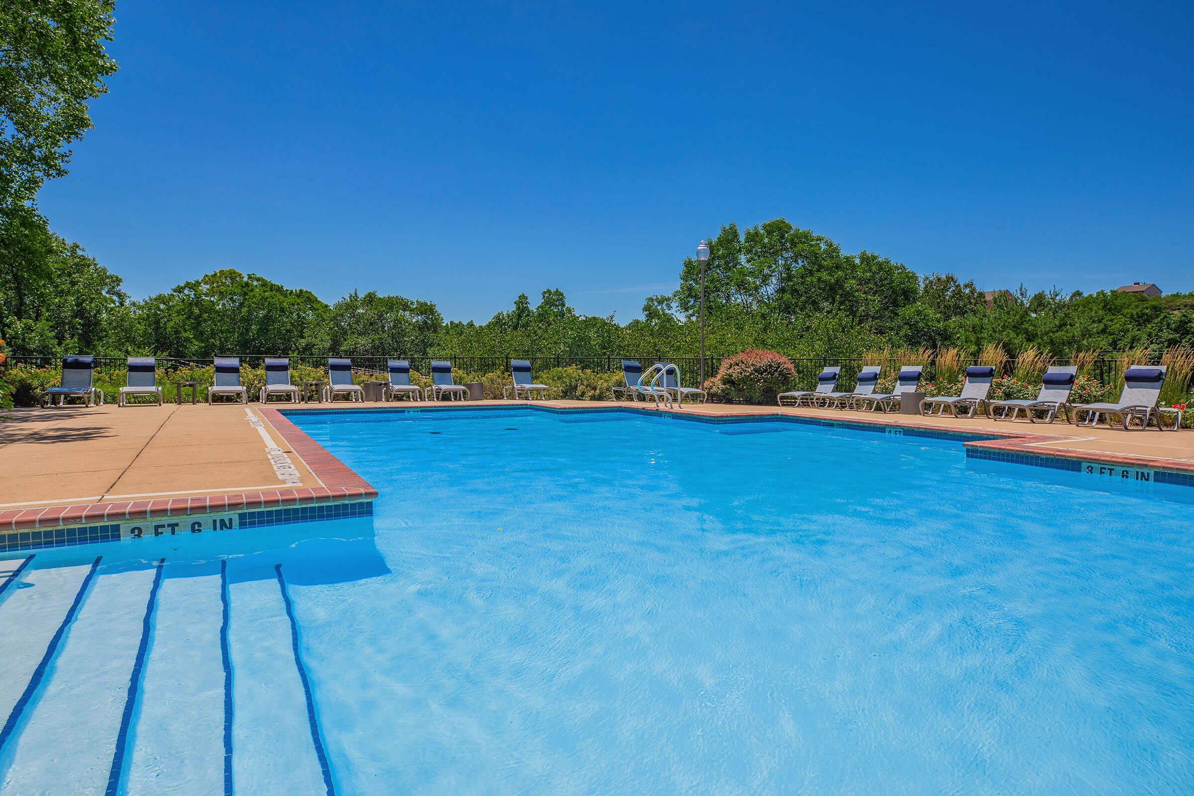 a pool next to a body of water