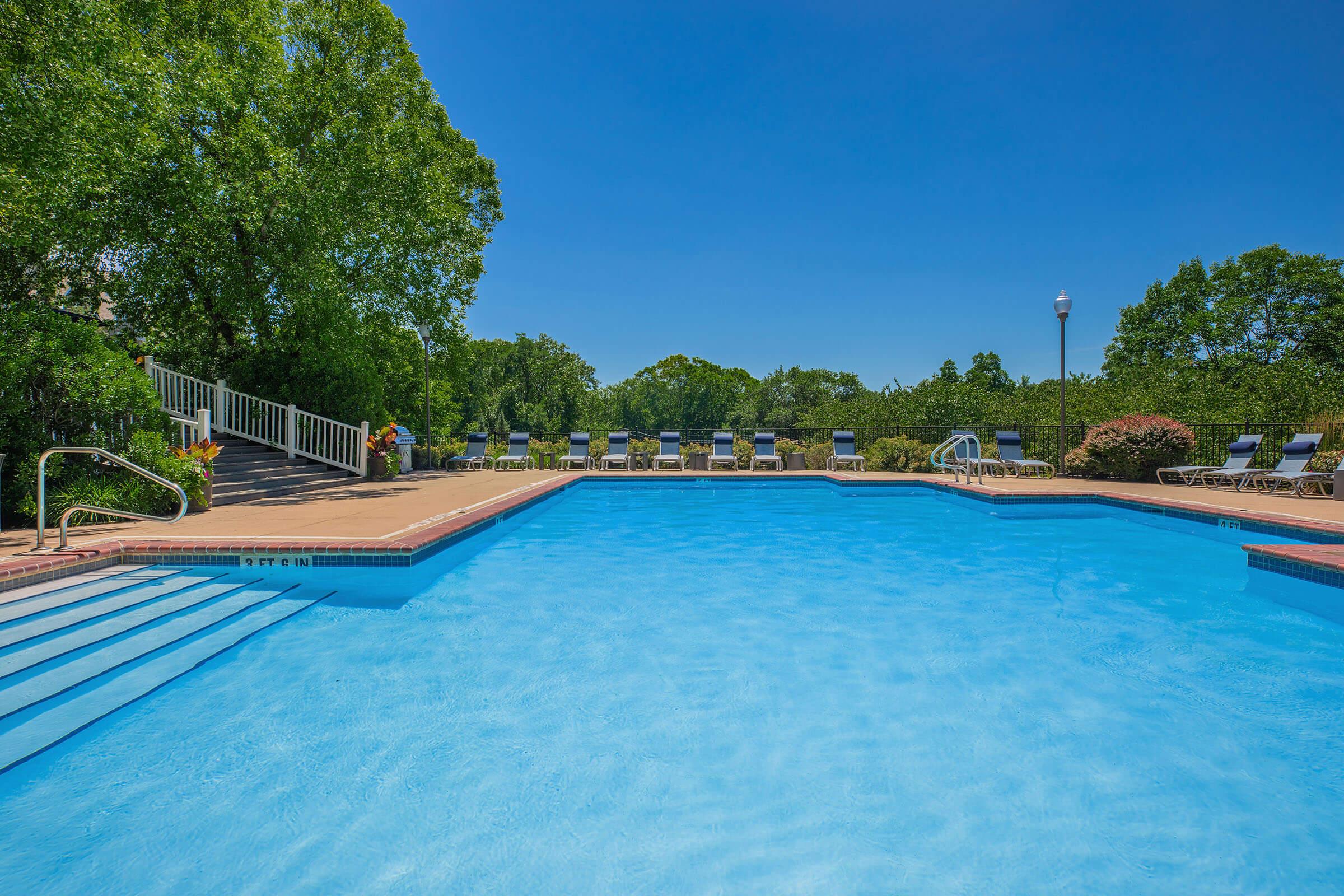 a pool next to a body of water