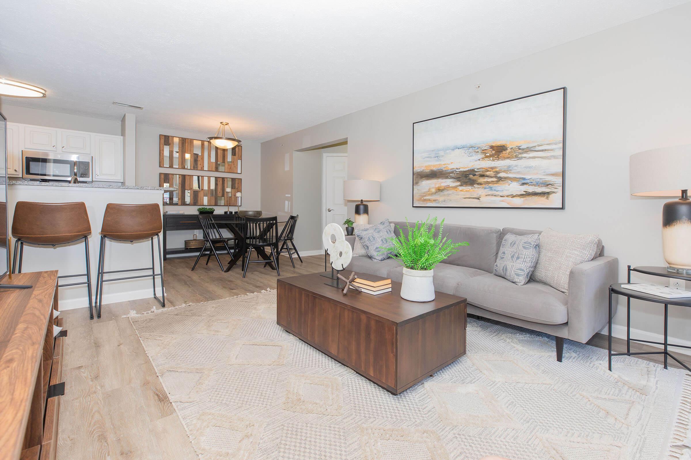 a living room filled with furniture and a fireplace