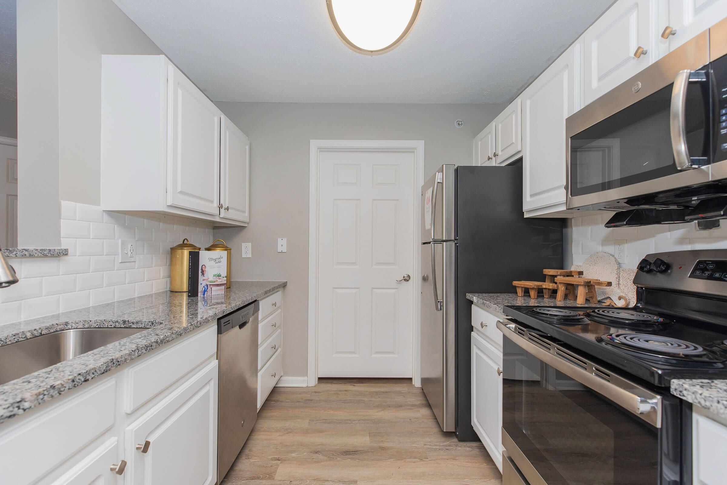 a modern kitchen with stainless steel appliances