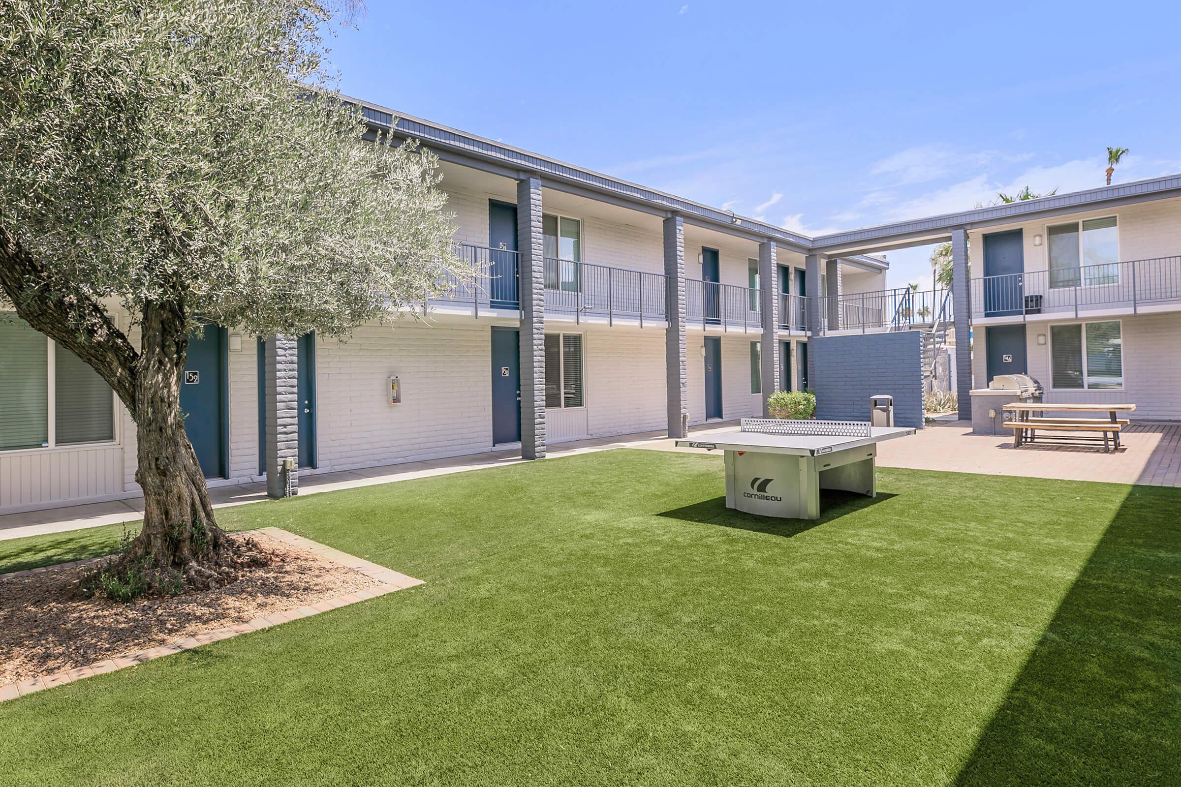 Outdoor grass area in front of a two-story Phoenix, AZ apartment building