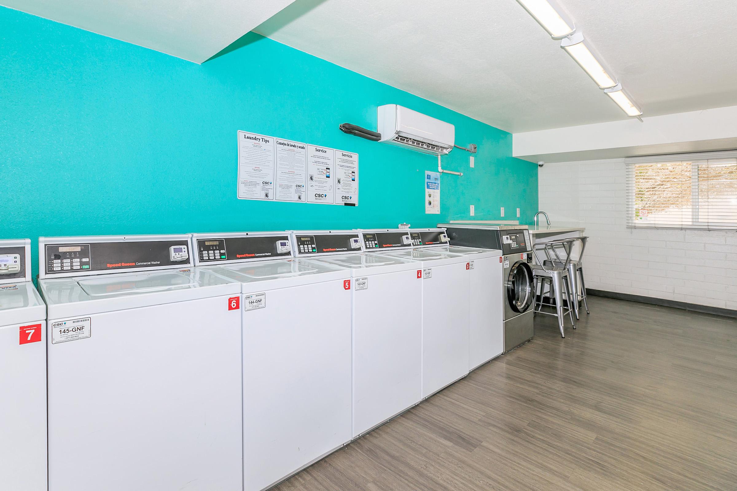 Rise Canyon West community laundry facility with washer and dryers