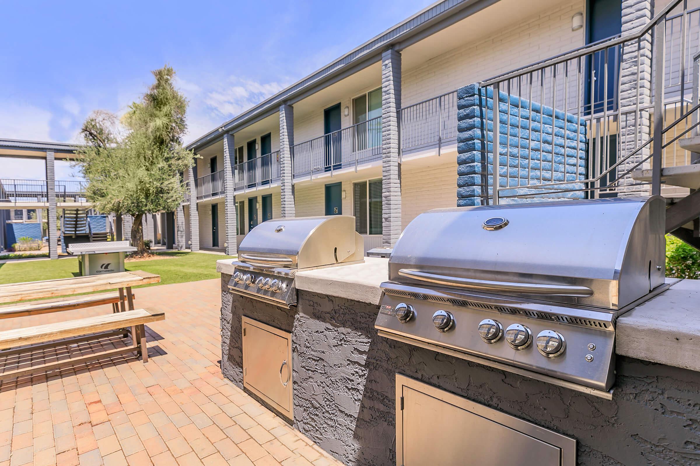 Rise Canyon West's outdoor grilling area with stainless steel bbq grills
