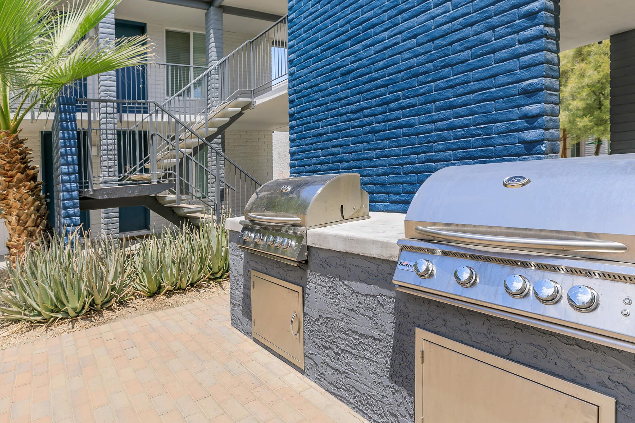 Stainless steel bbq grills in Rise Canyon West outdoor community grilling area