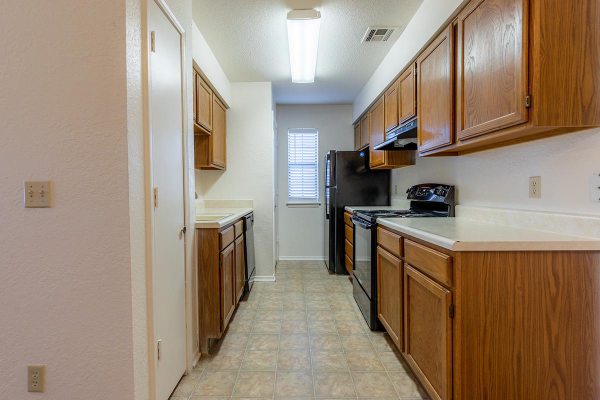a kitchen with a tile floor