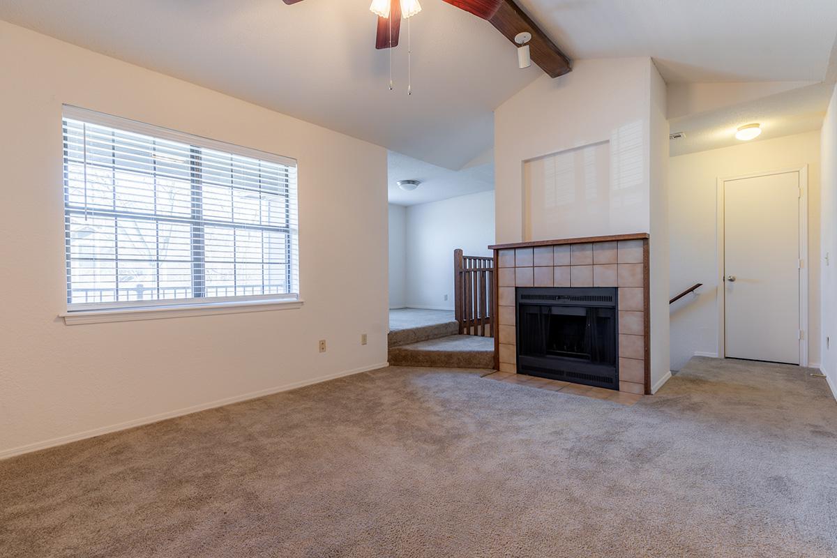 a large empty room with a wood floor