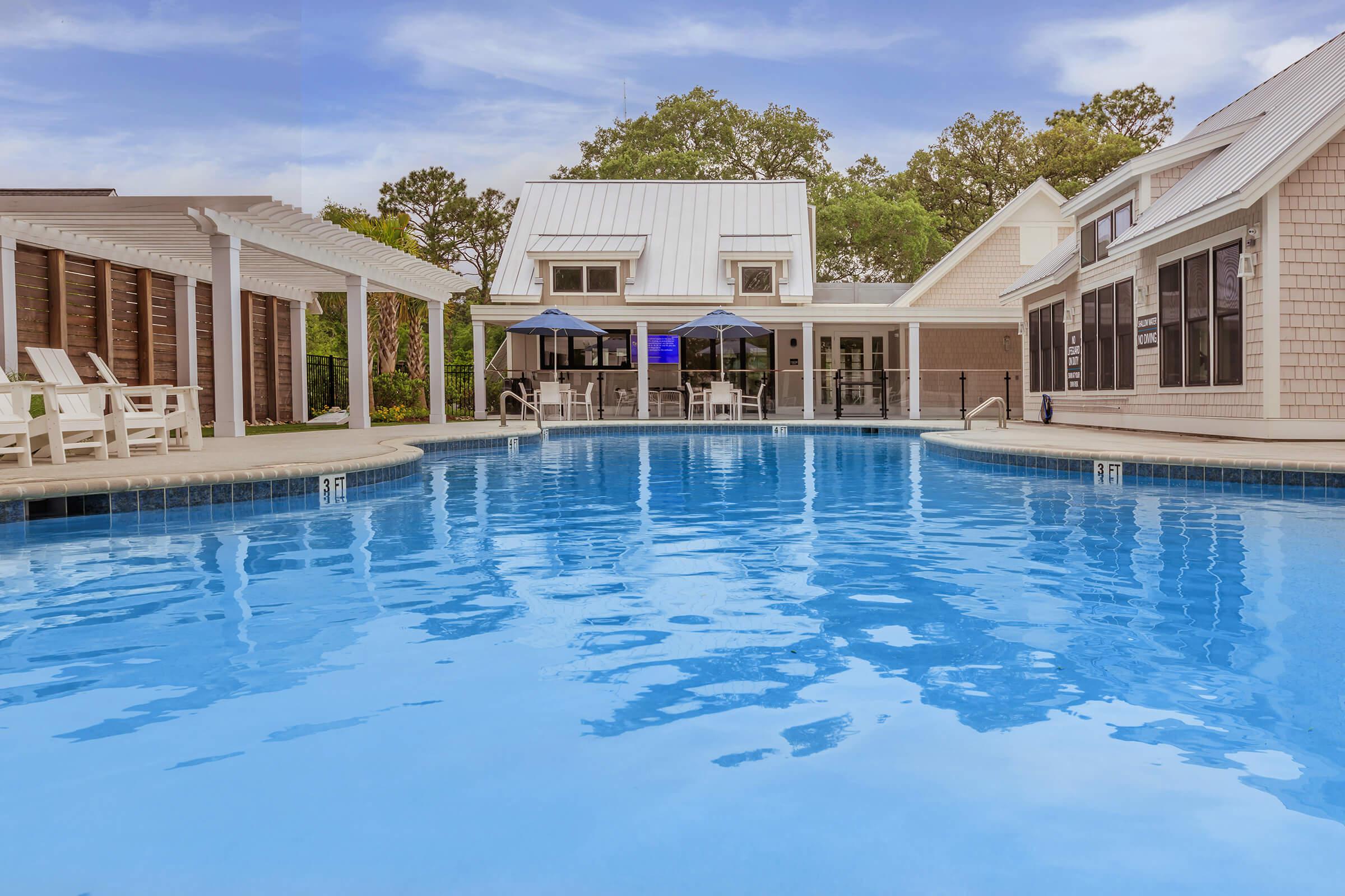 a house with a large pool of water