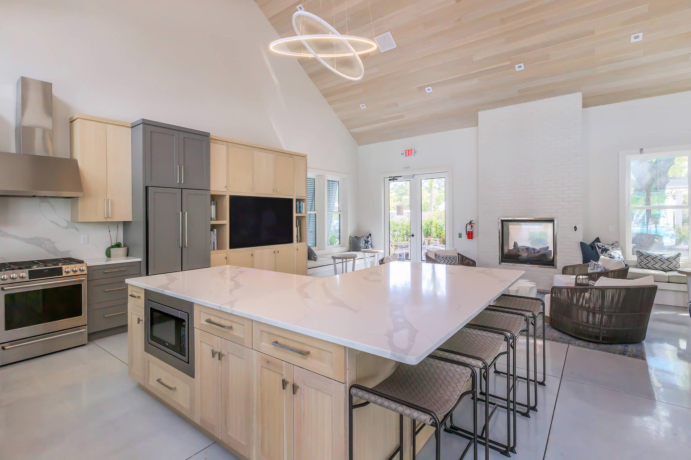 a kitchen with an island in the middle of a room