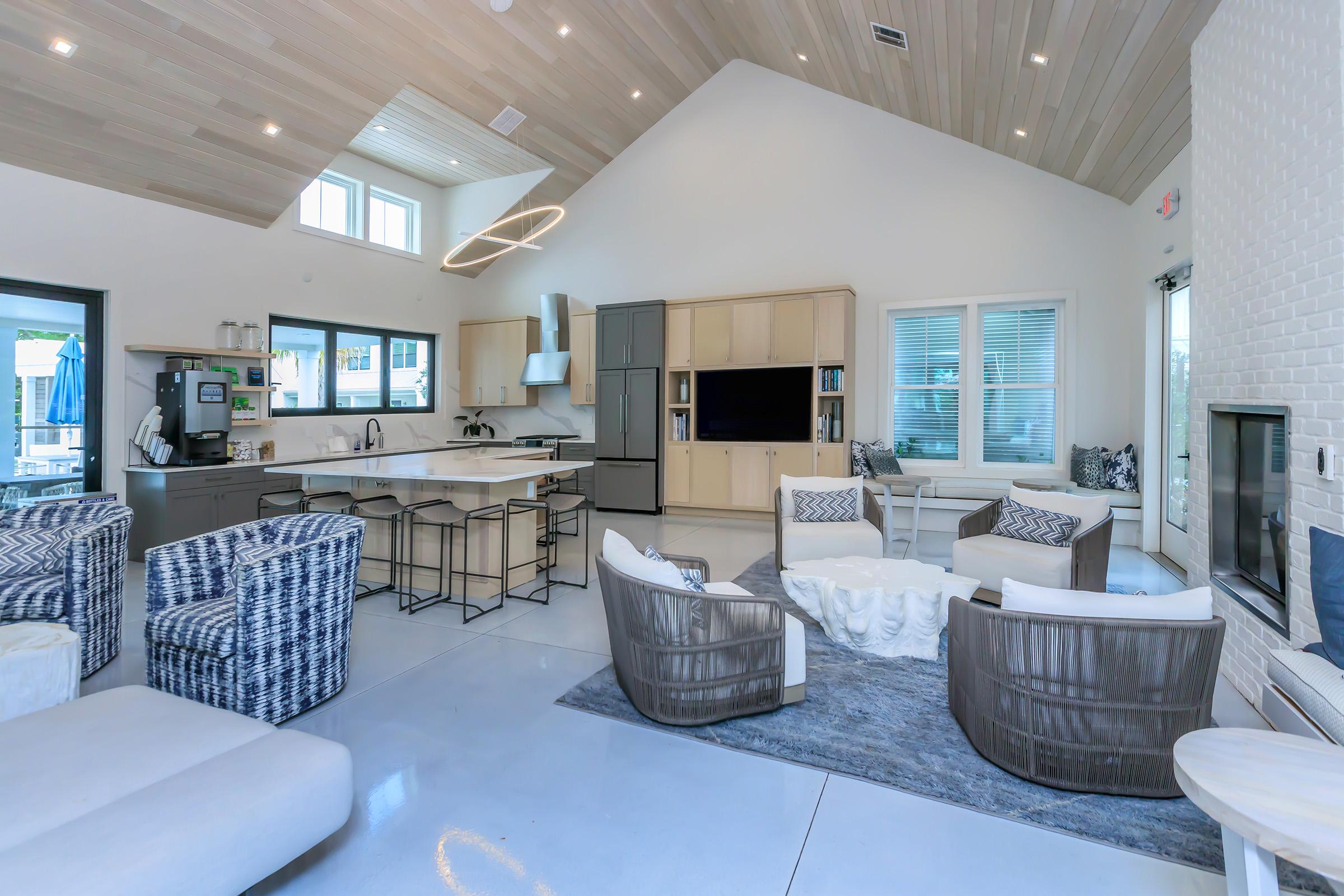 a living room filled with furniture and a large window