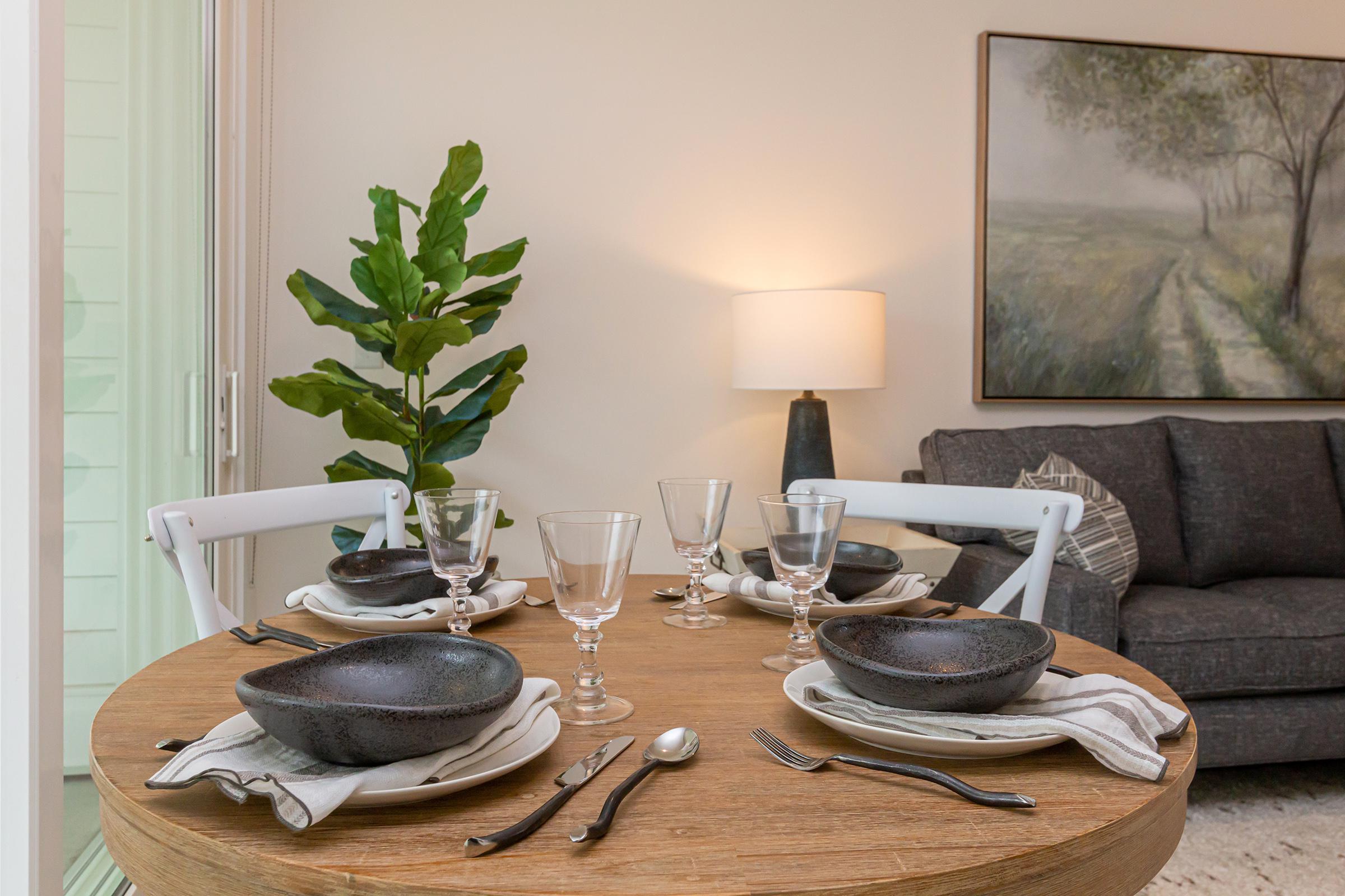 a room filled with furniture and vase on a table