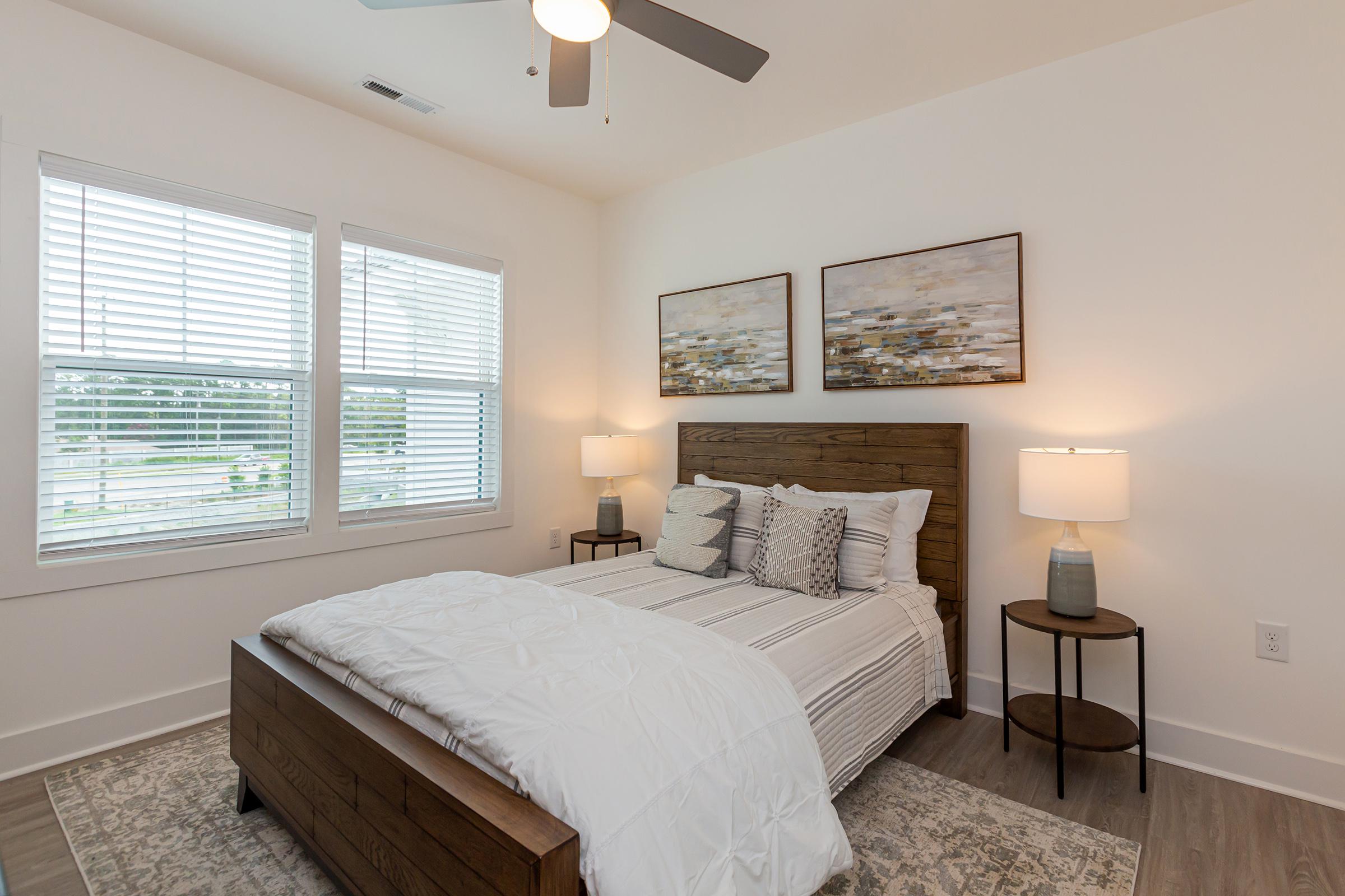 a bedroom with a bed and window in a room