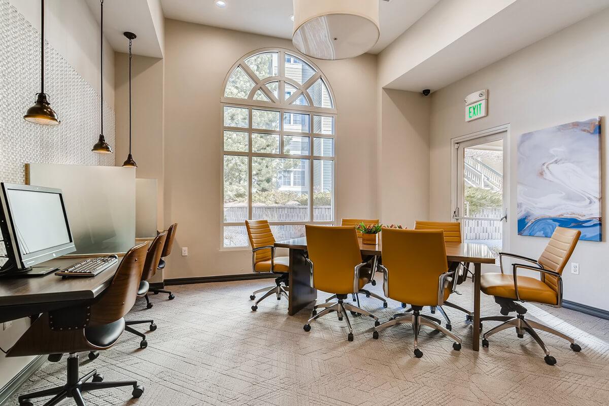 a room filled with furniture and a large window