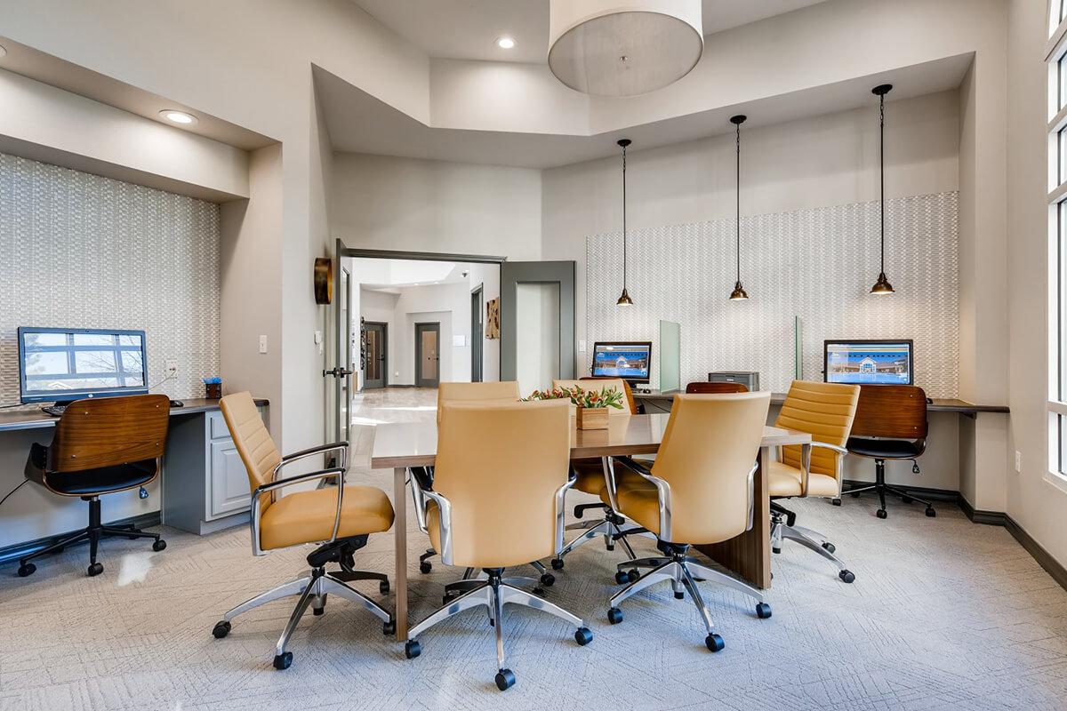 an office with a desk and chair in a room