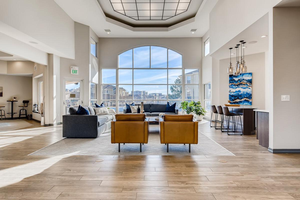 a room filled with furniture and a large window