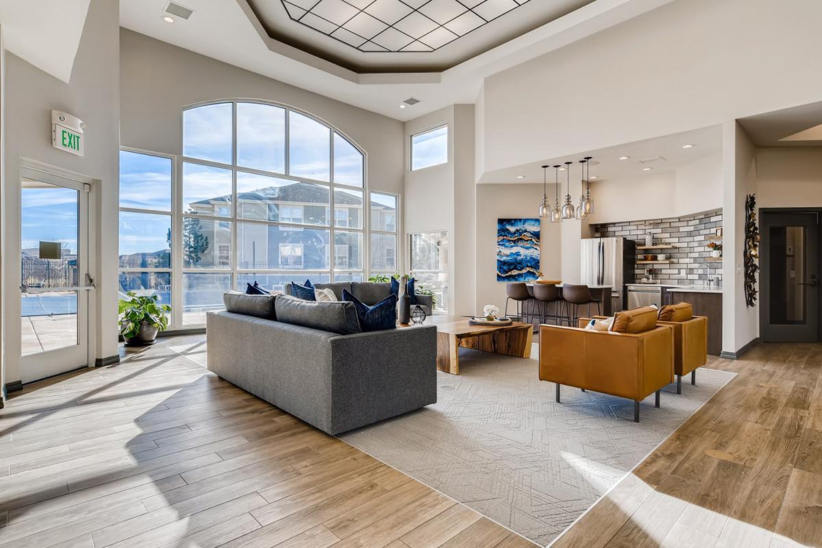 a living room filled with furniture and a large window