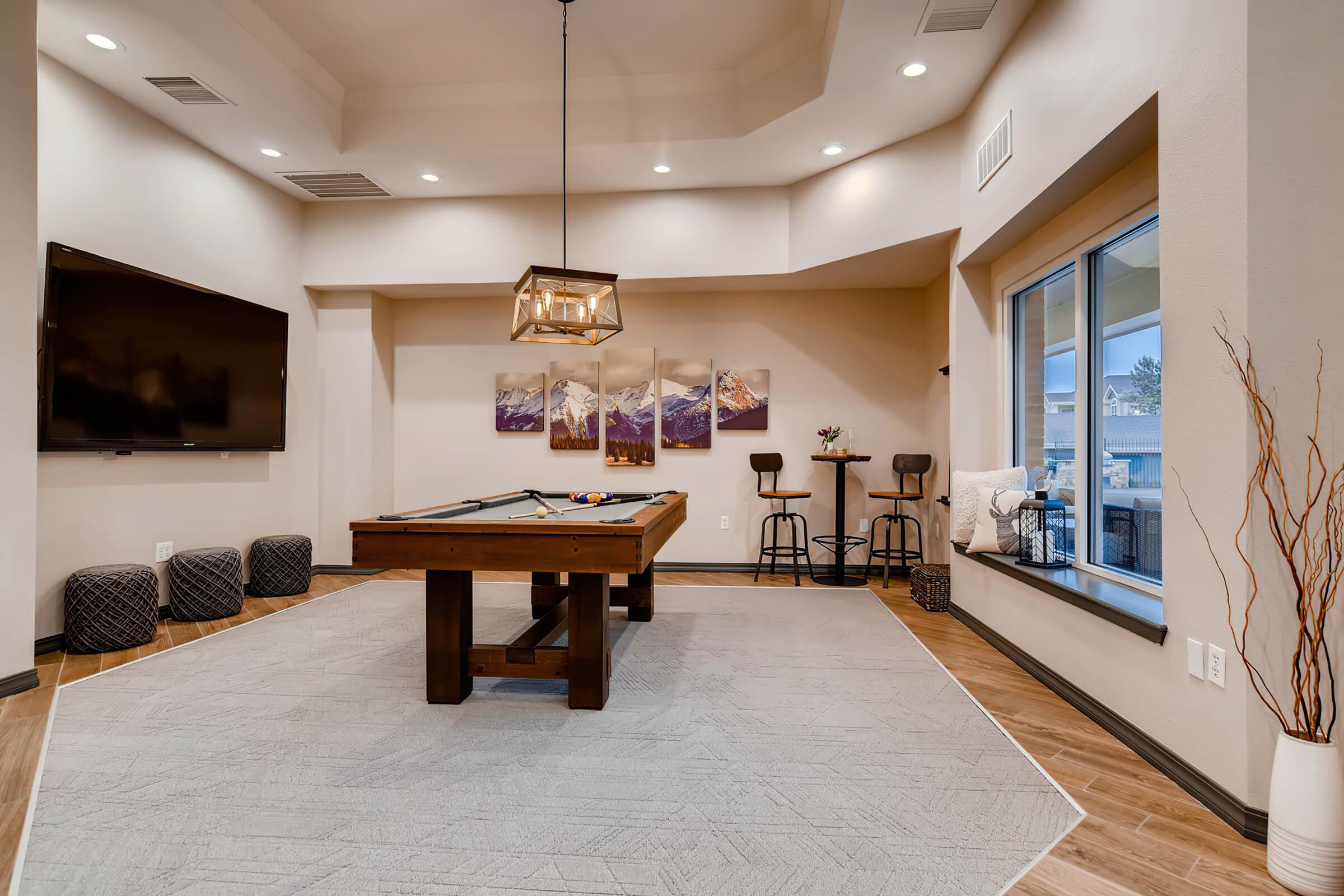 a living room filled with furniture and a fireplace