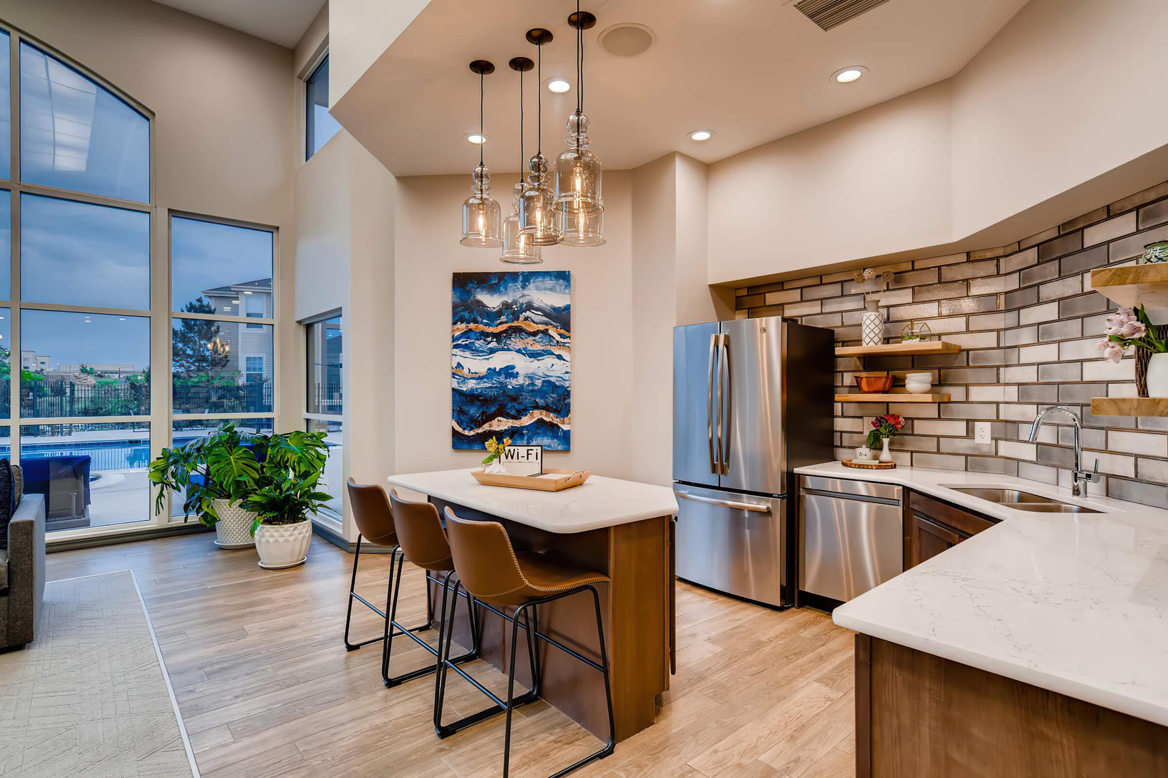 a kitchen with an island in the middle of a room