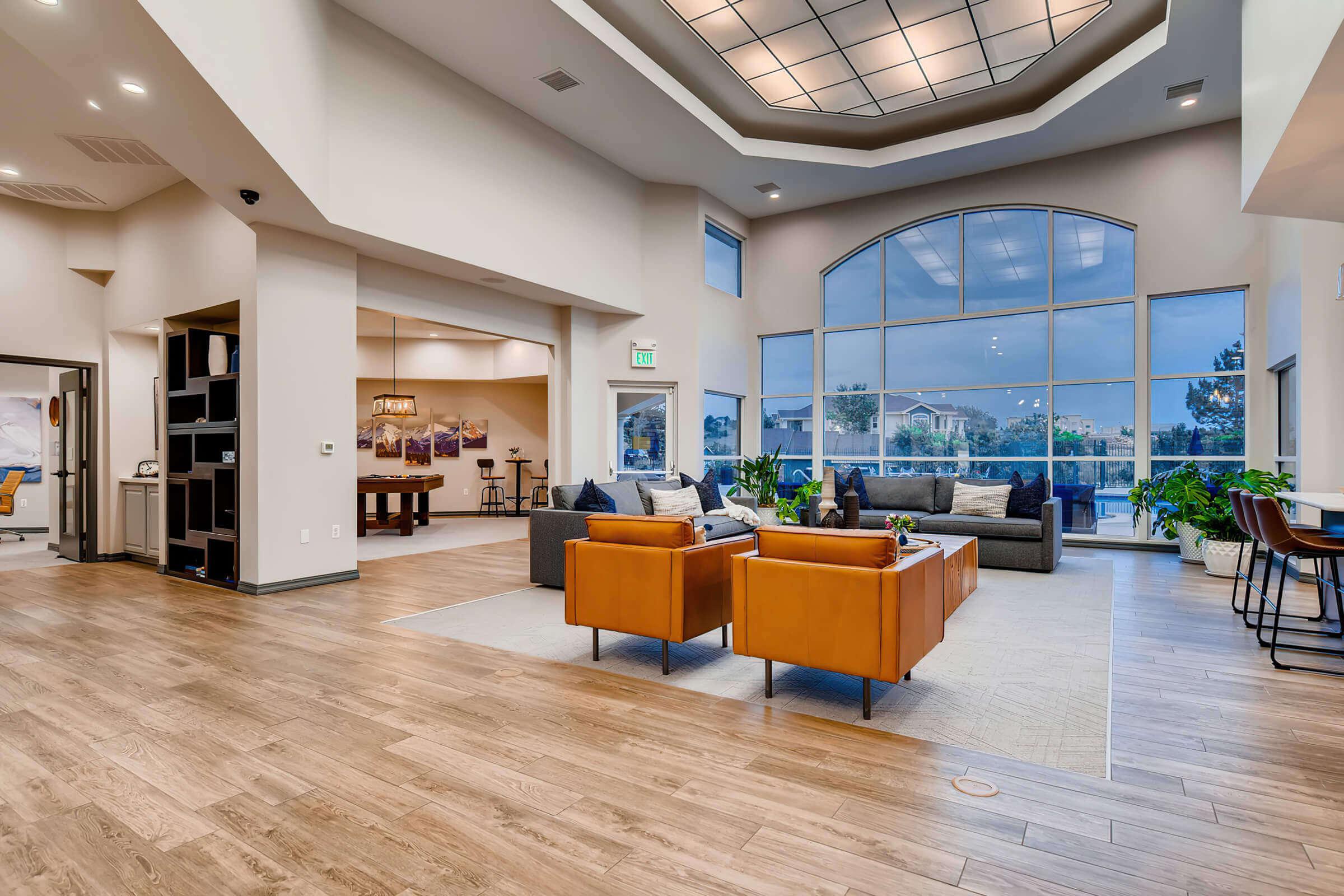 a room filled with furniture next to a building