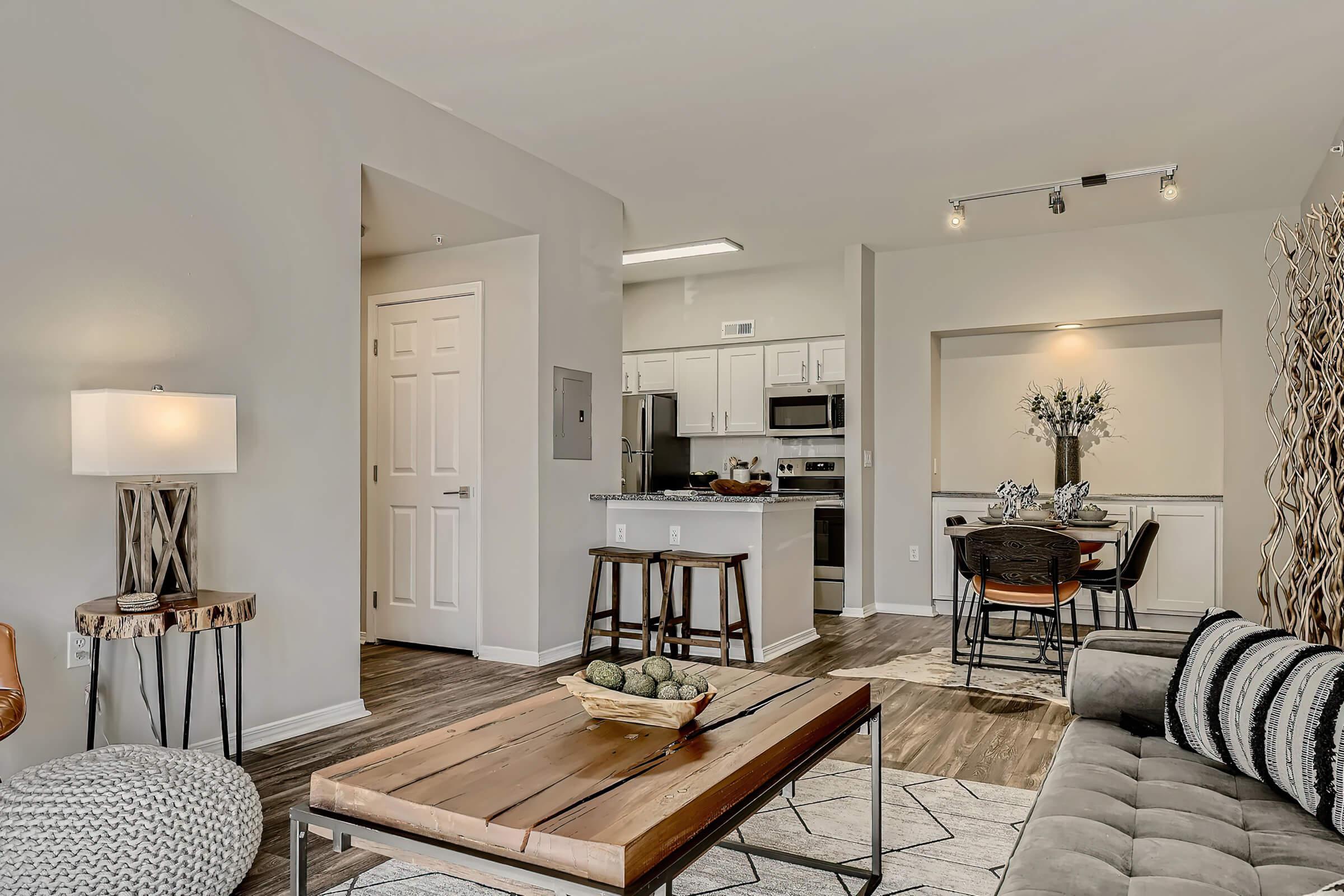 a living room filled with furniture and a table