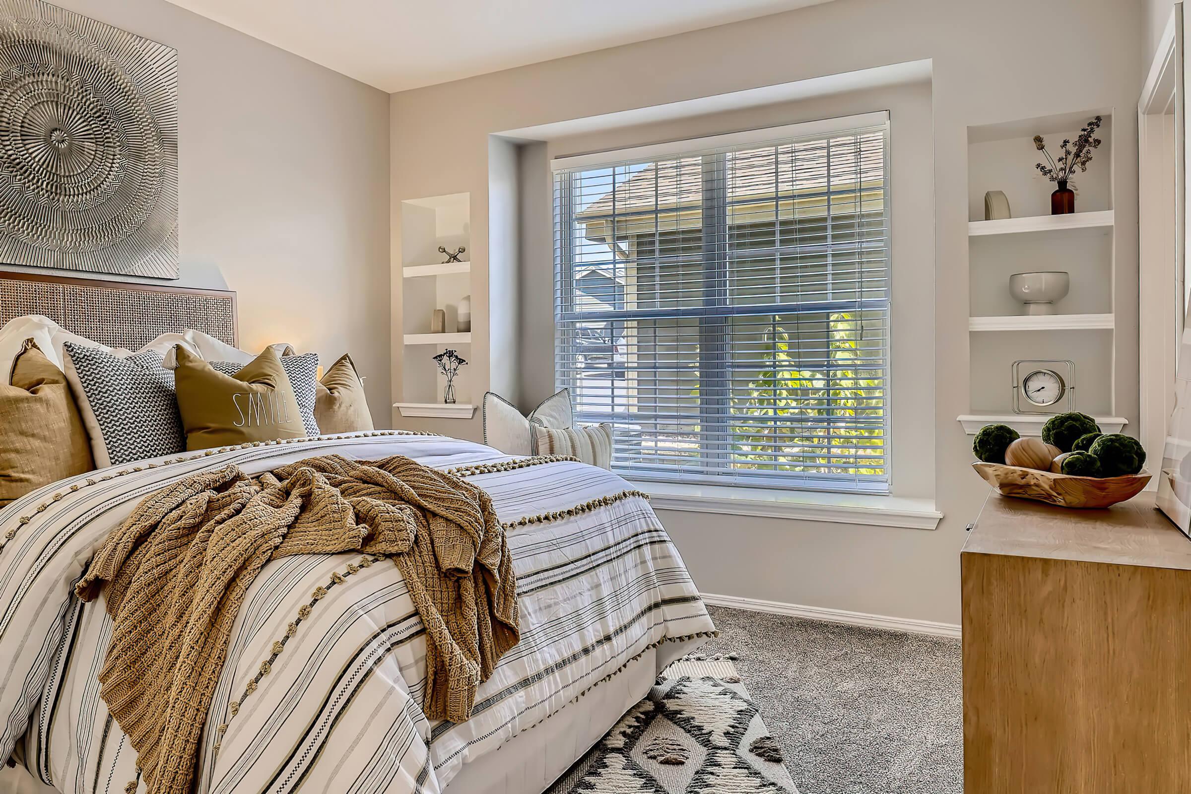 a bedroom with a bed and a fireplace