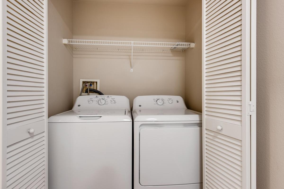 a white refrigerator freezer sitting next to a window