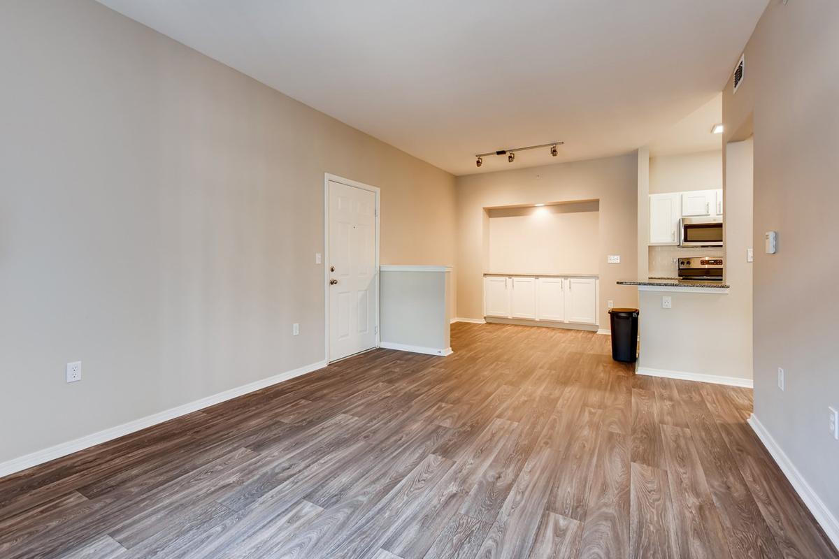 a large empty room with a wood floor