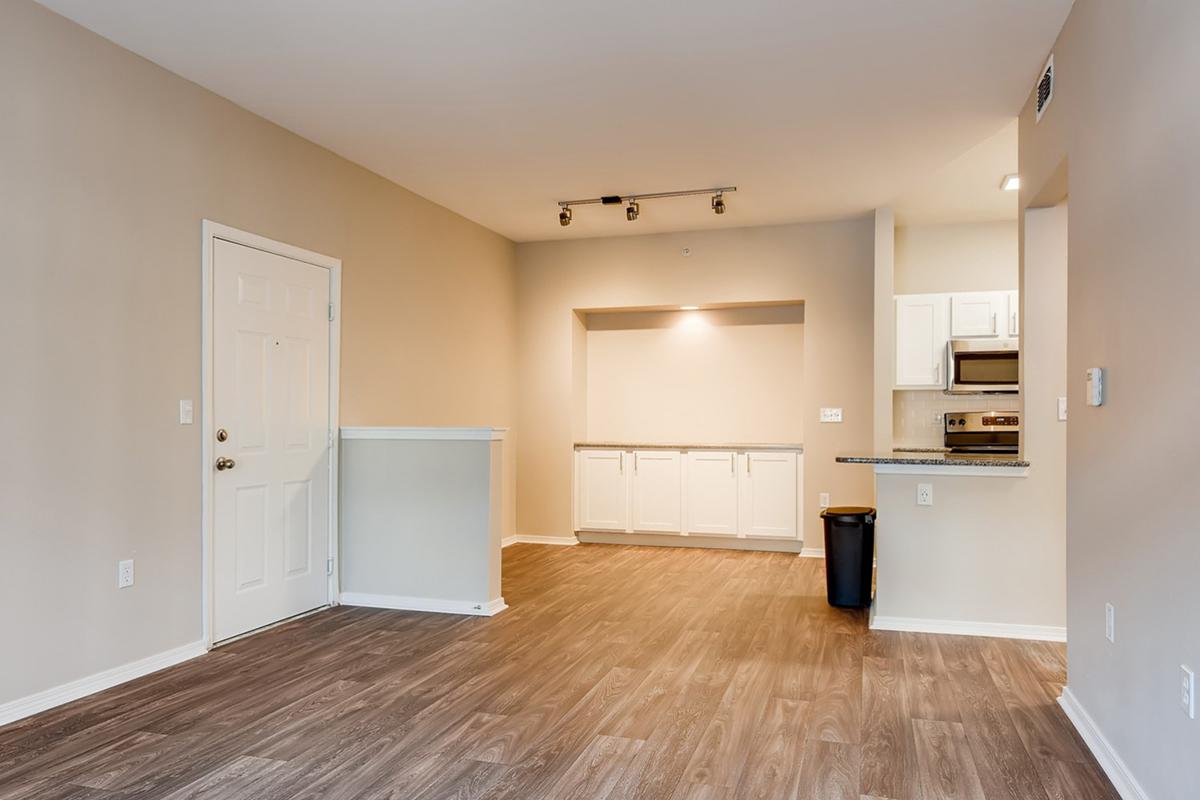 a large empty room with a wood floor