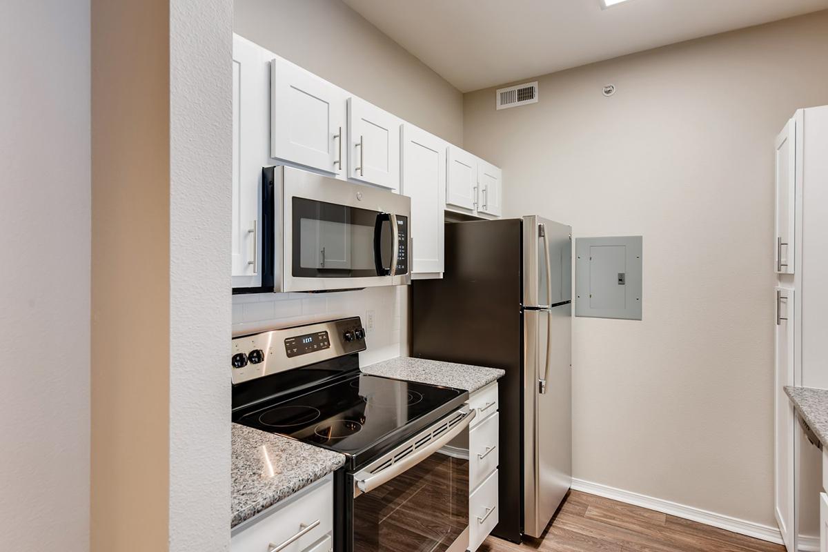 a kitchen with a stove top oven sitting inside of a refrigerator