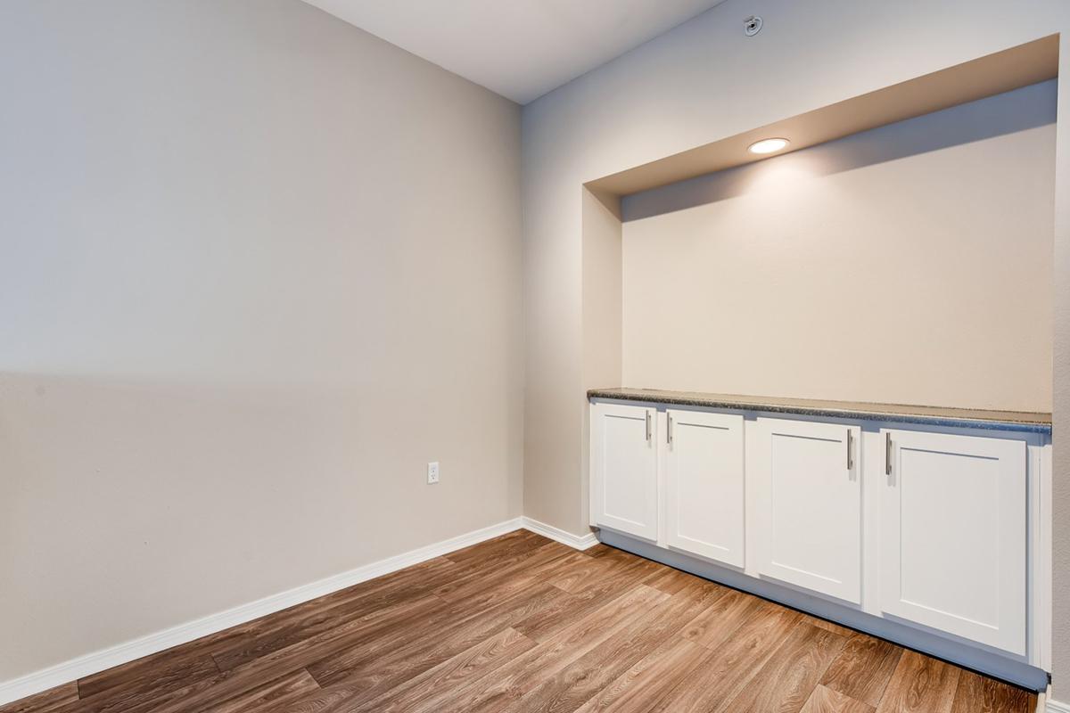 a large empty room with a wood floor