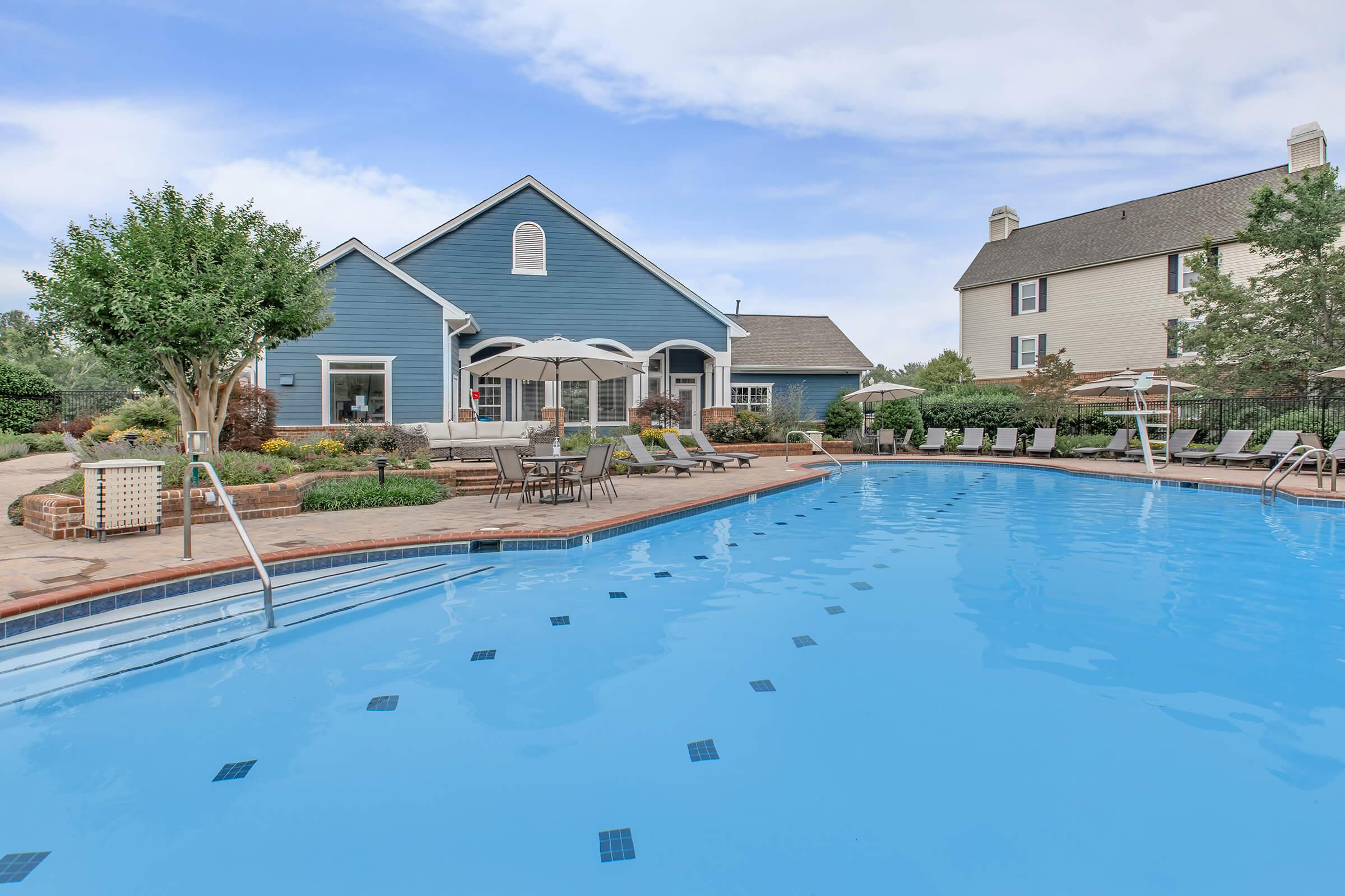 a house with a large pool of water