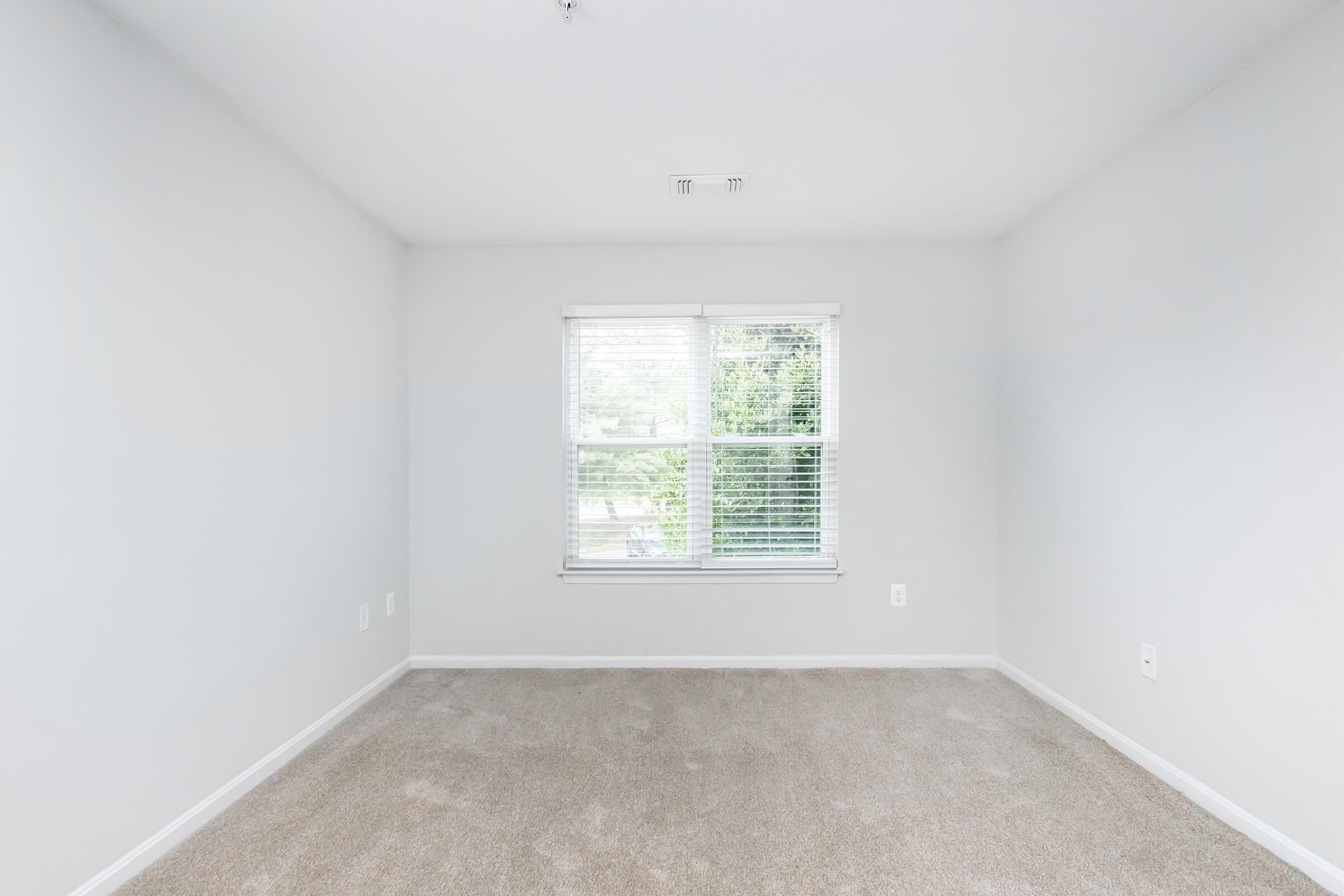 a room with a sink and a window