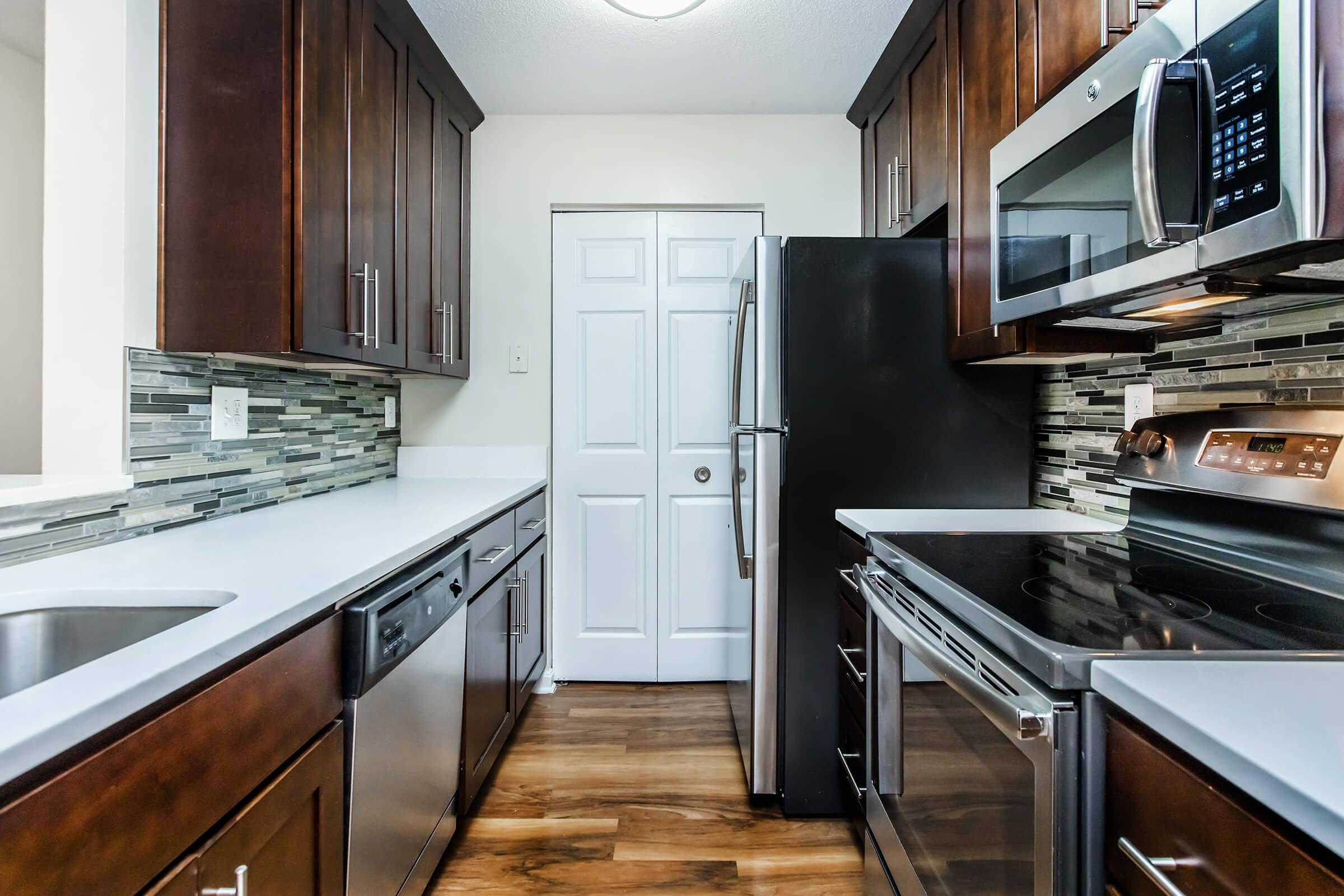 a kitchen with a stove top oven