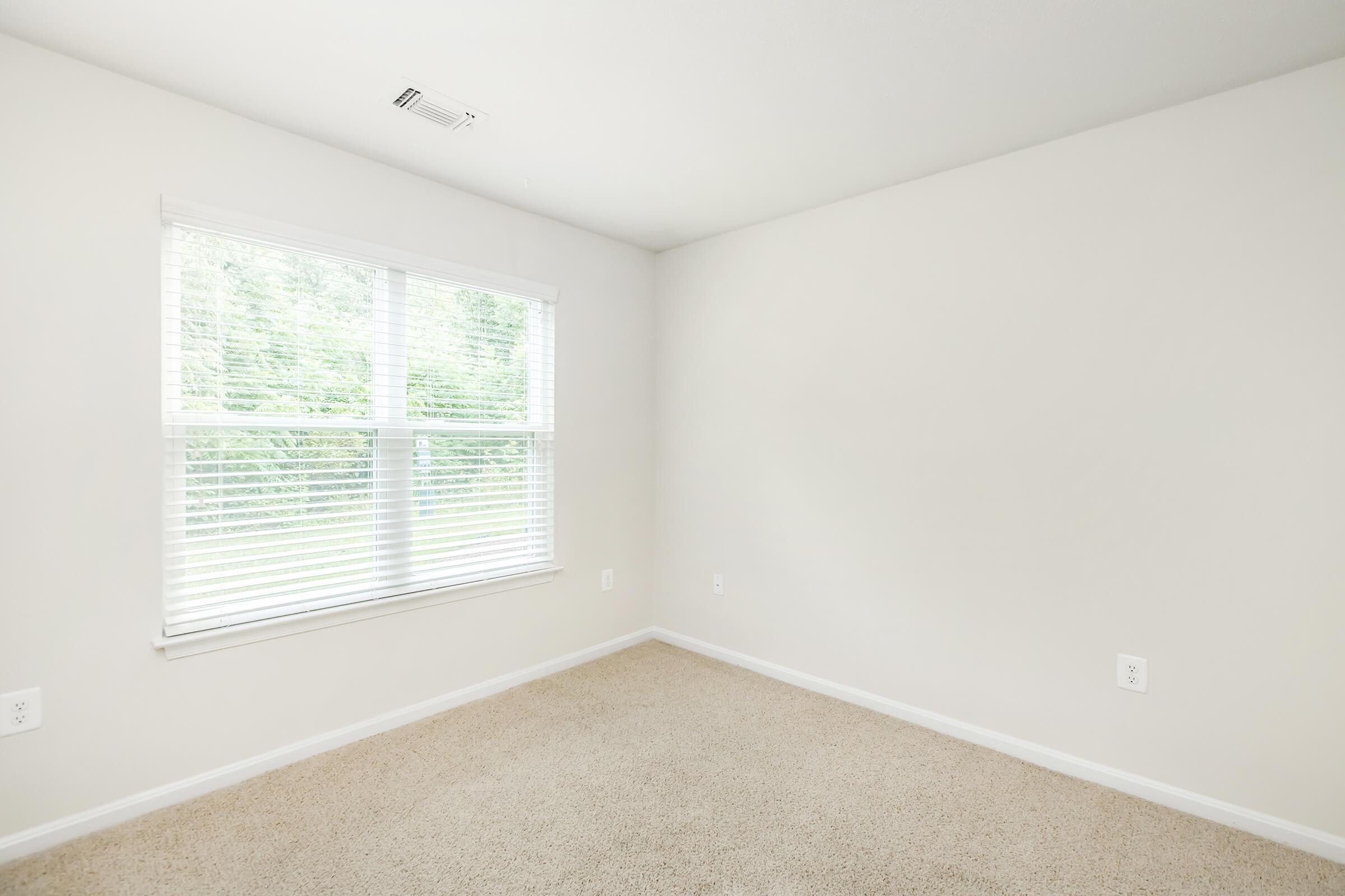 a room with a sink and a window