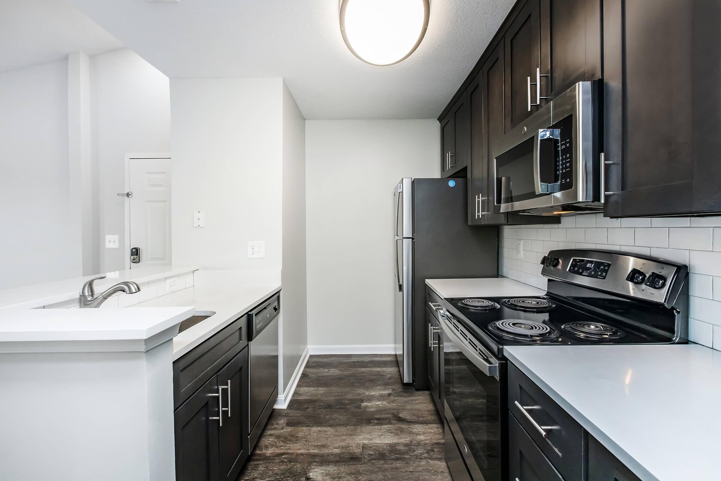 a kitchen with a stove and a sink