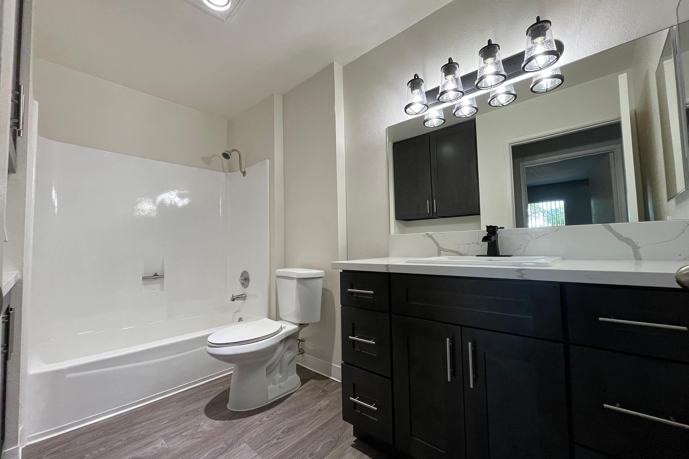 a bathroom with white countertops