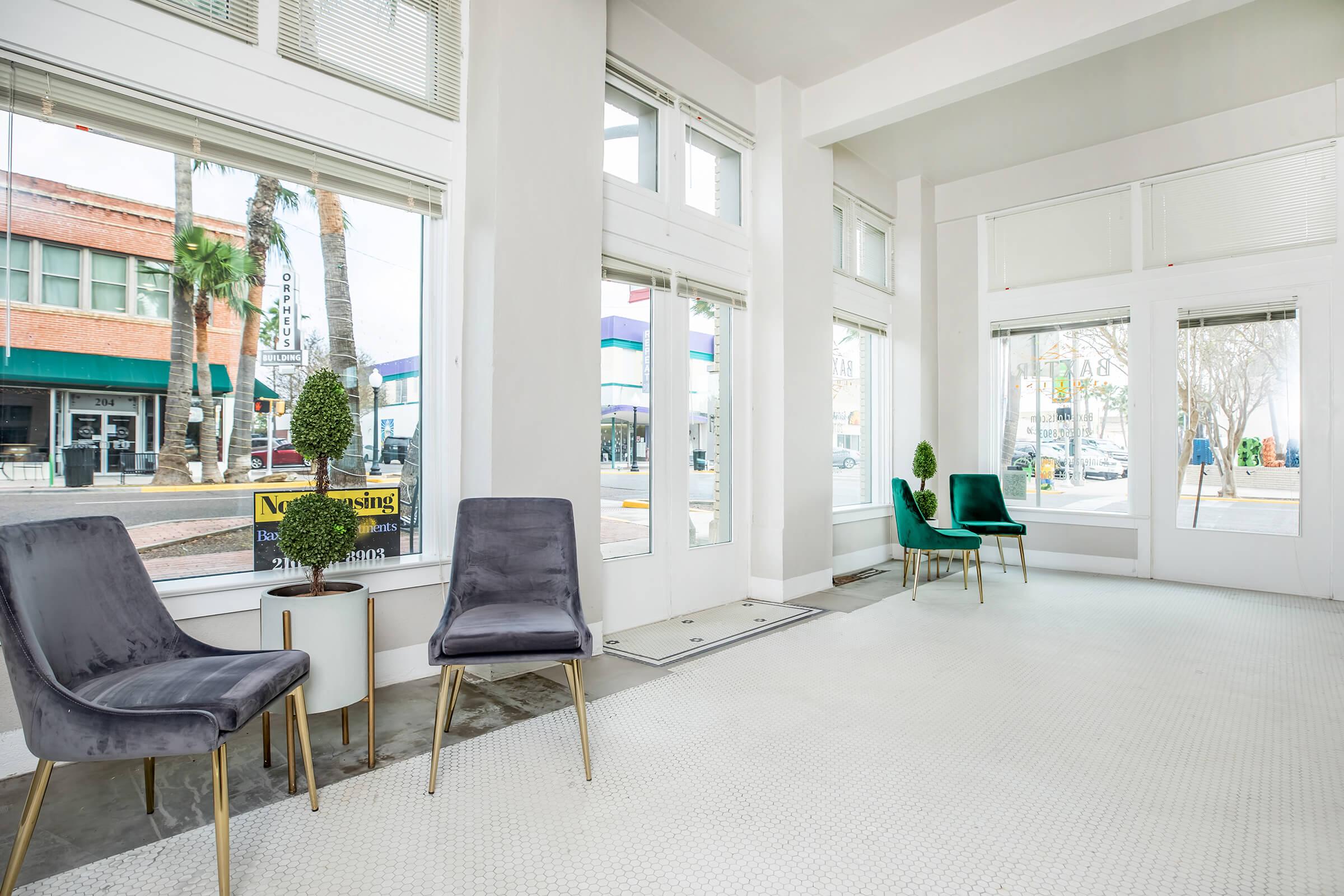 a living room filled with furniture and a large window