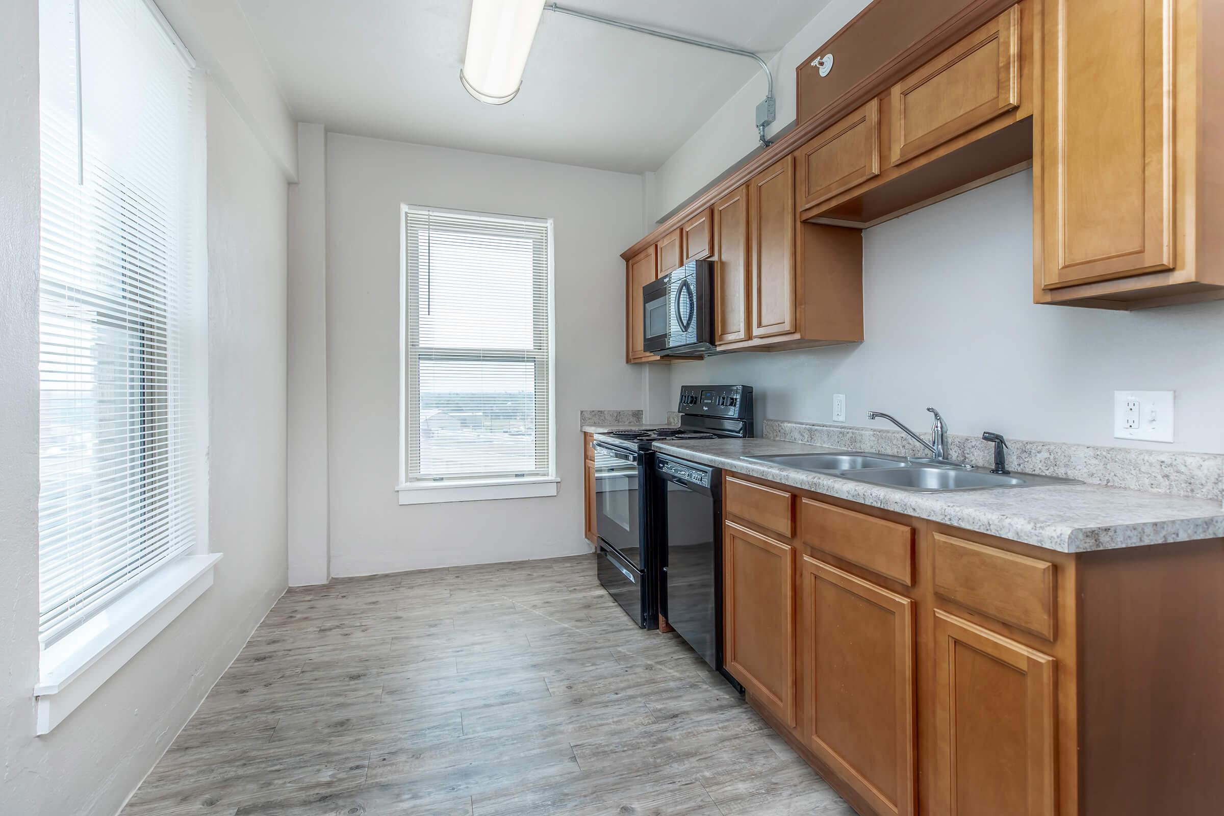 a kitchen with a sink and a window