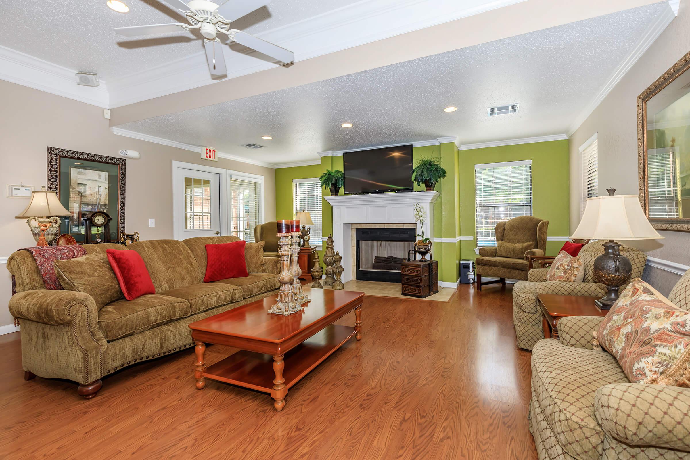 a living room filled with furniture and a fire place