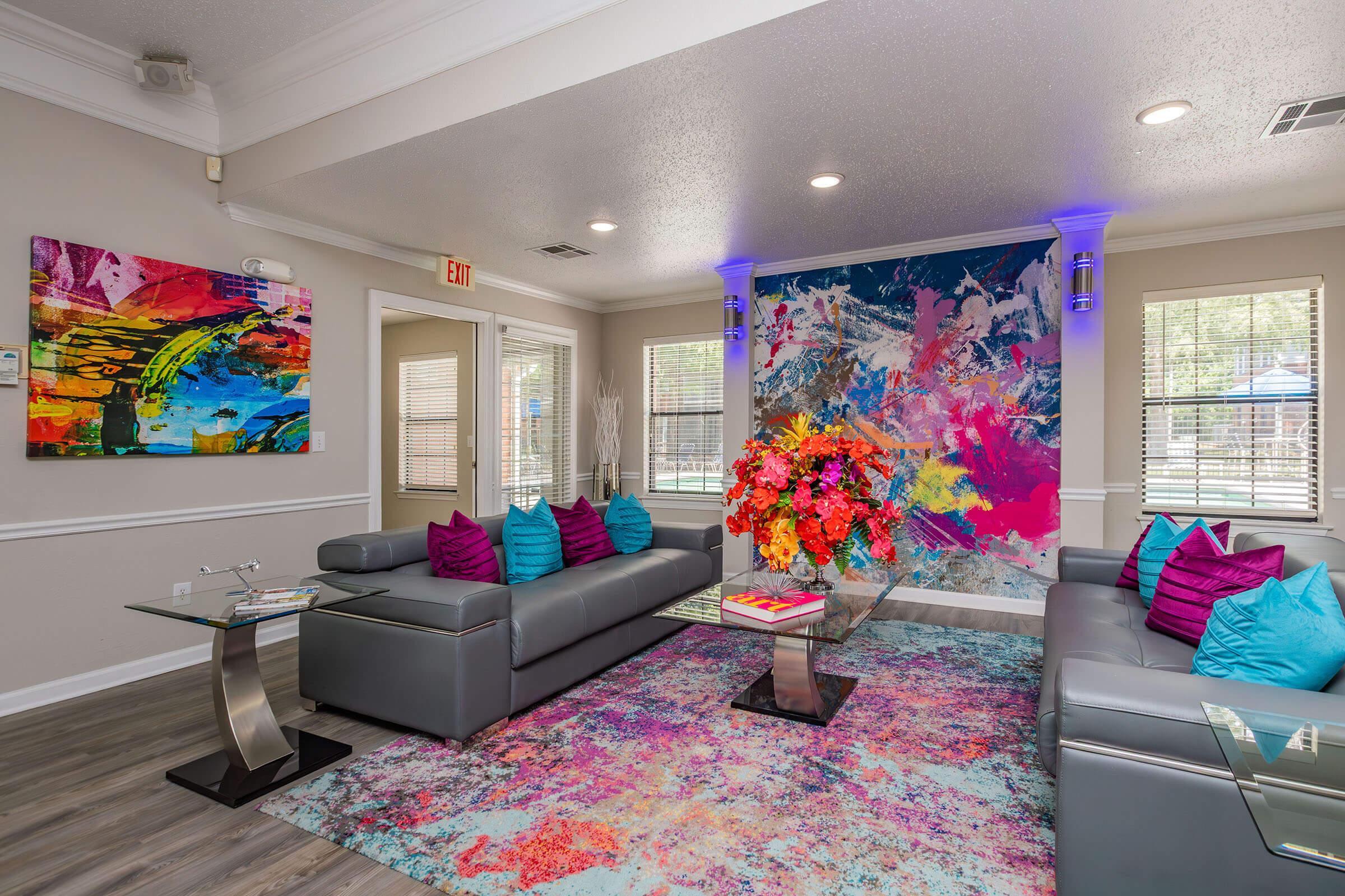 a living room filled with furniture and a flat screen tv