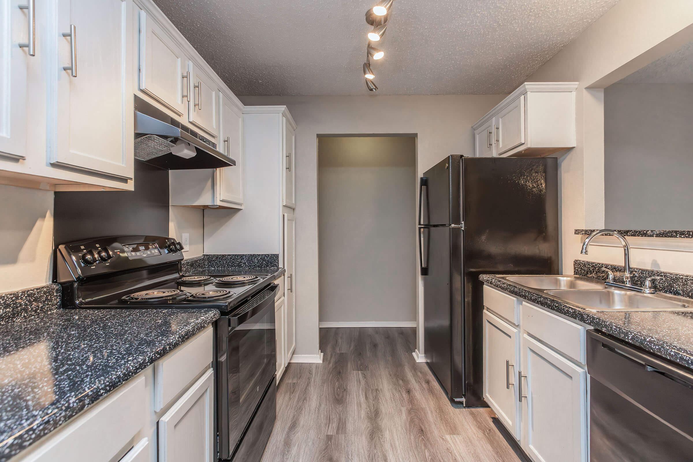 a modern kitchen with stainless steel appliances